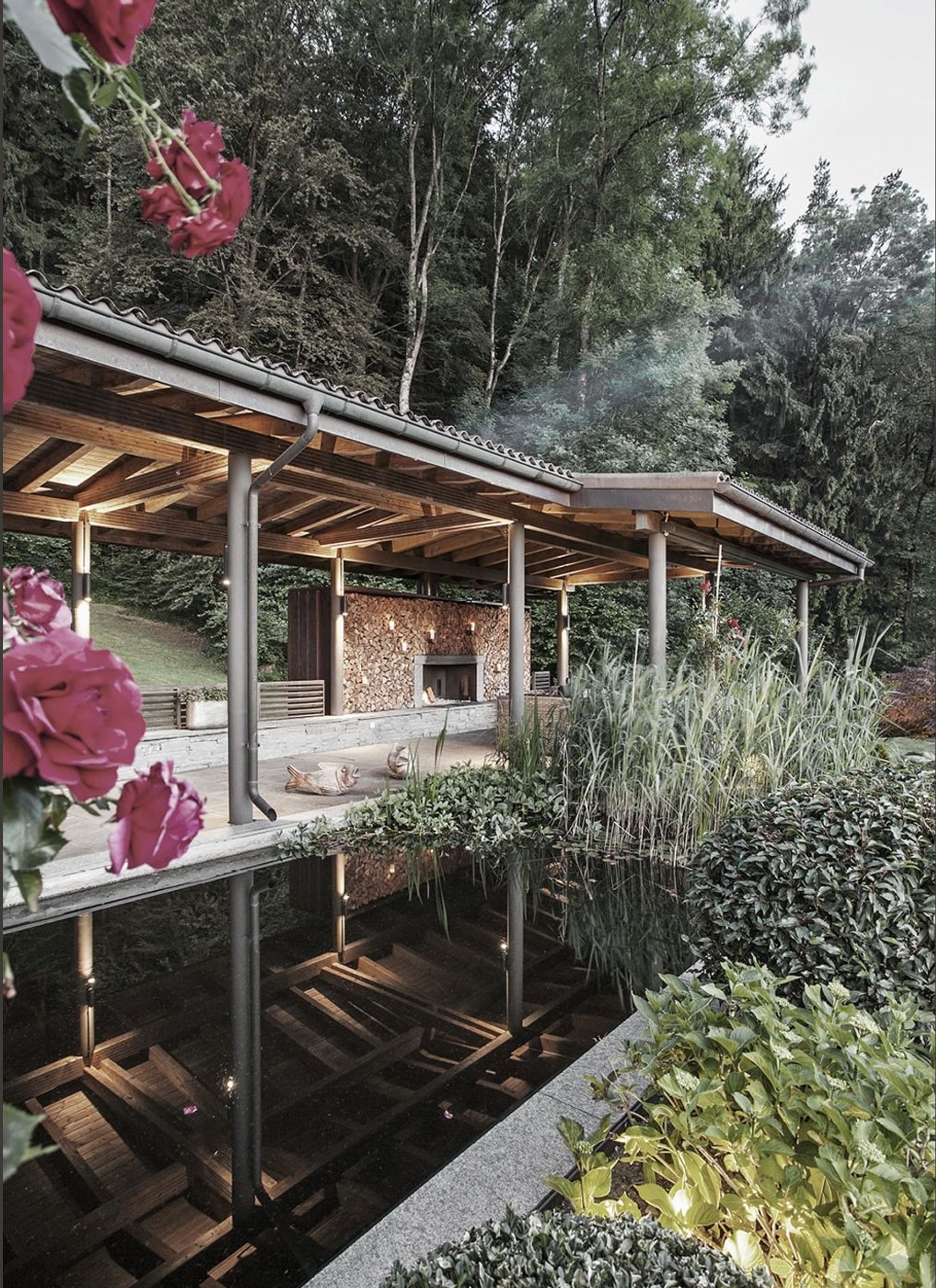 Water basin with roses in front of the covered seating area – Interiors and landscape, Stallikon