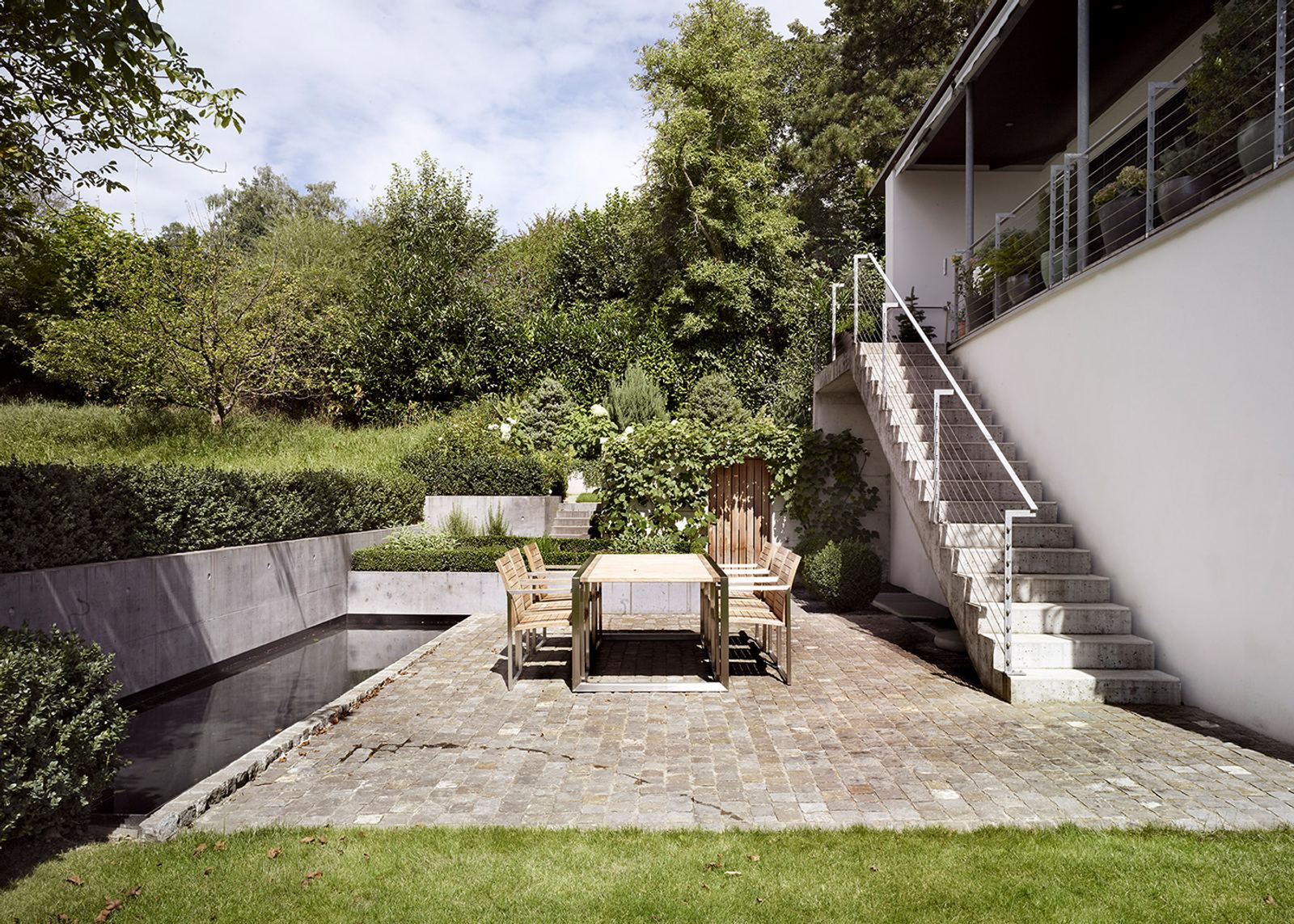 Paved seating area with outside staircase