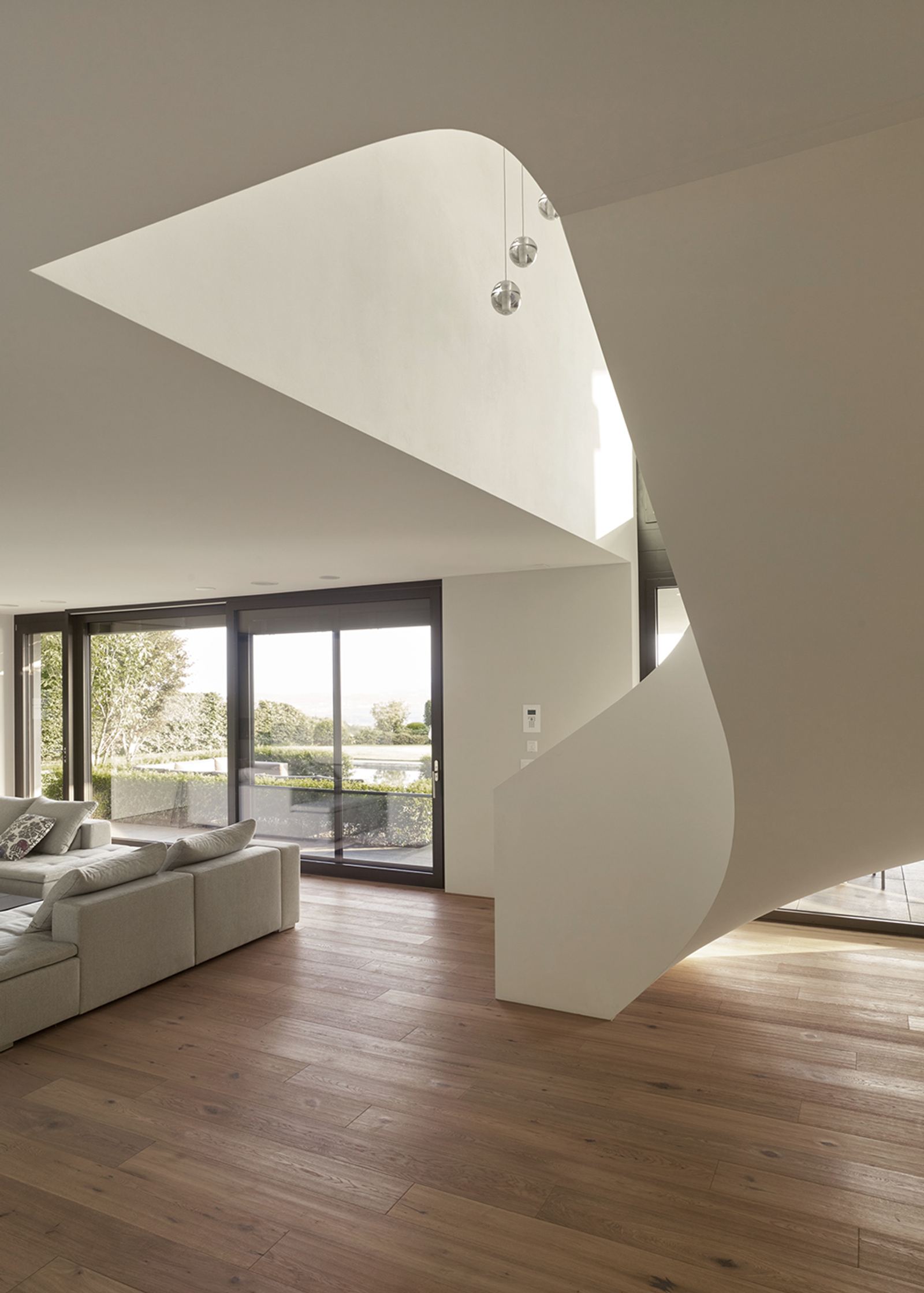 Sweeping white staircase in the living space