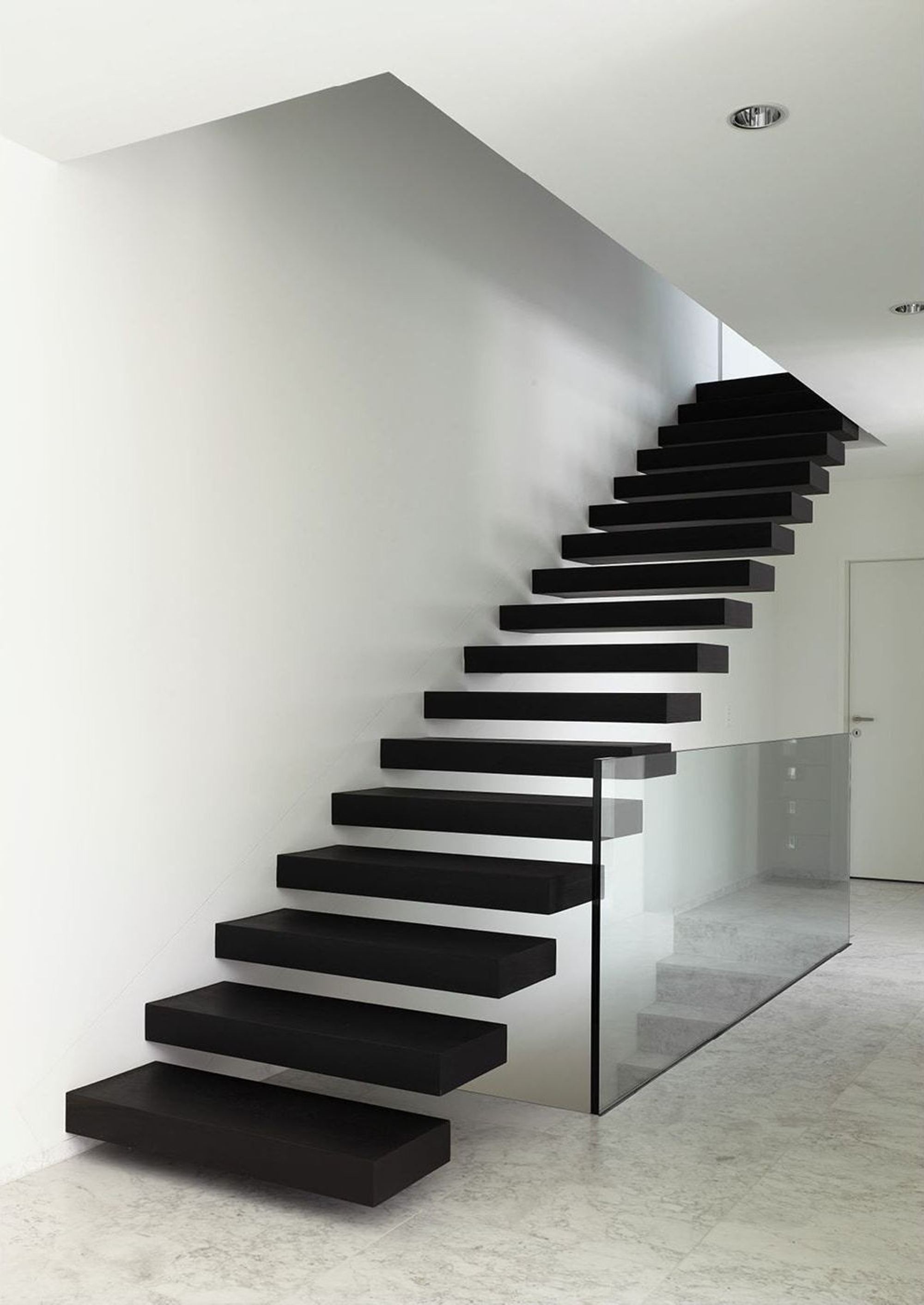 Floating black staircase with glass balustrade – Single-family house in Geroldswil