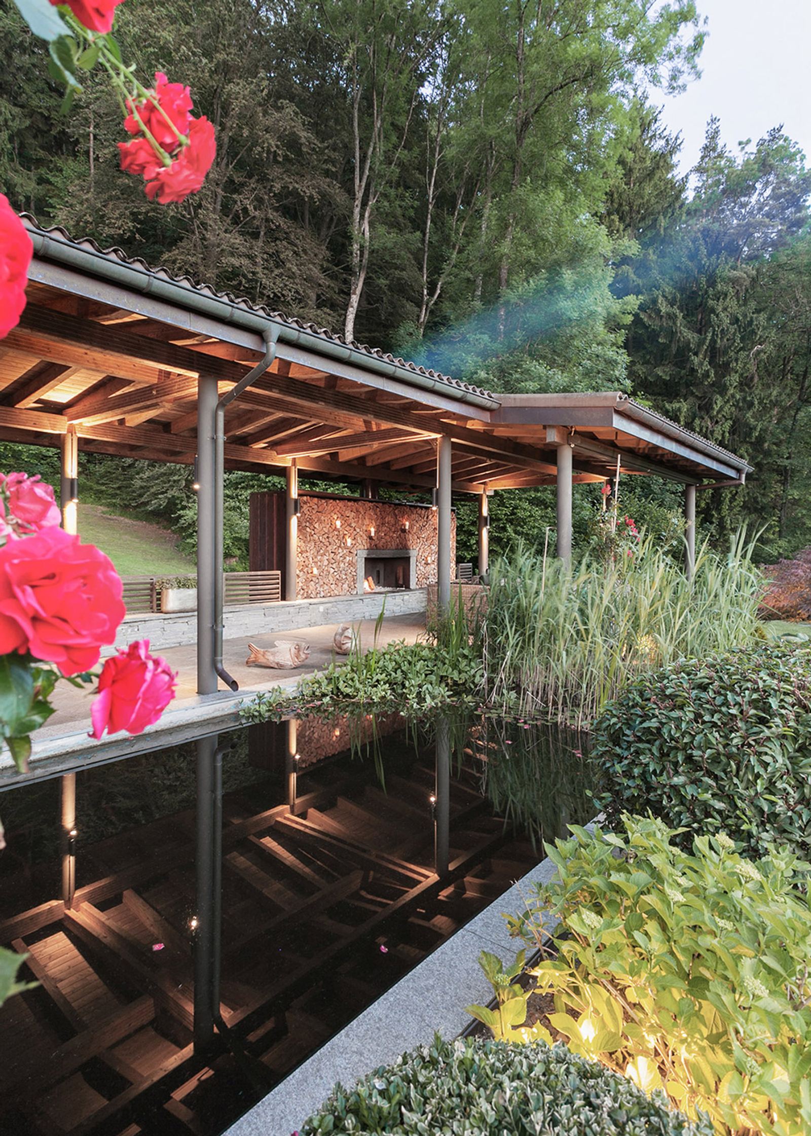 Water basin with roses in front of the covered seating area