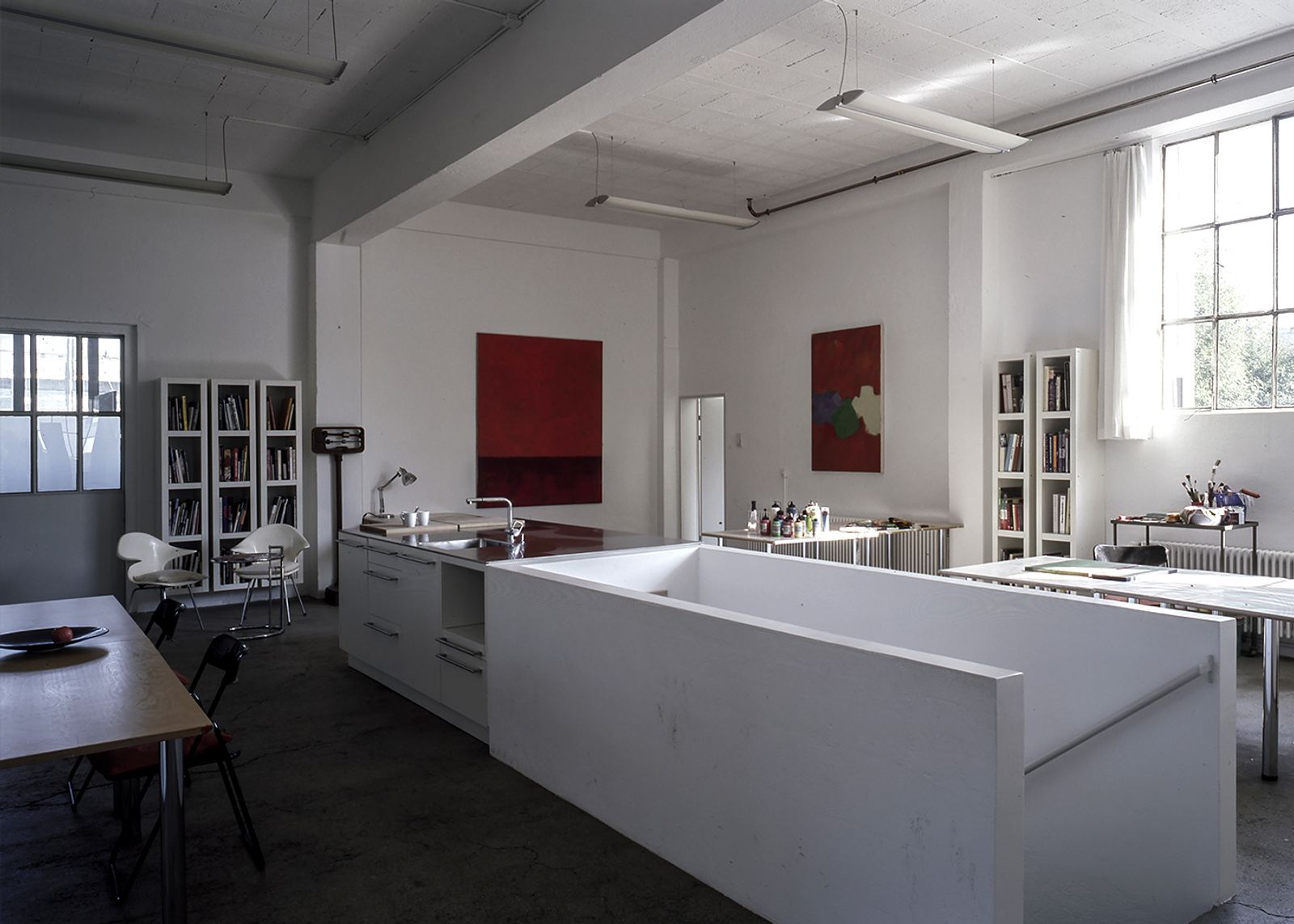 Loft kitchen with white block and art