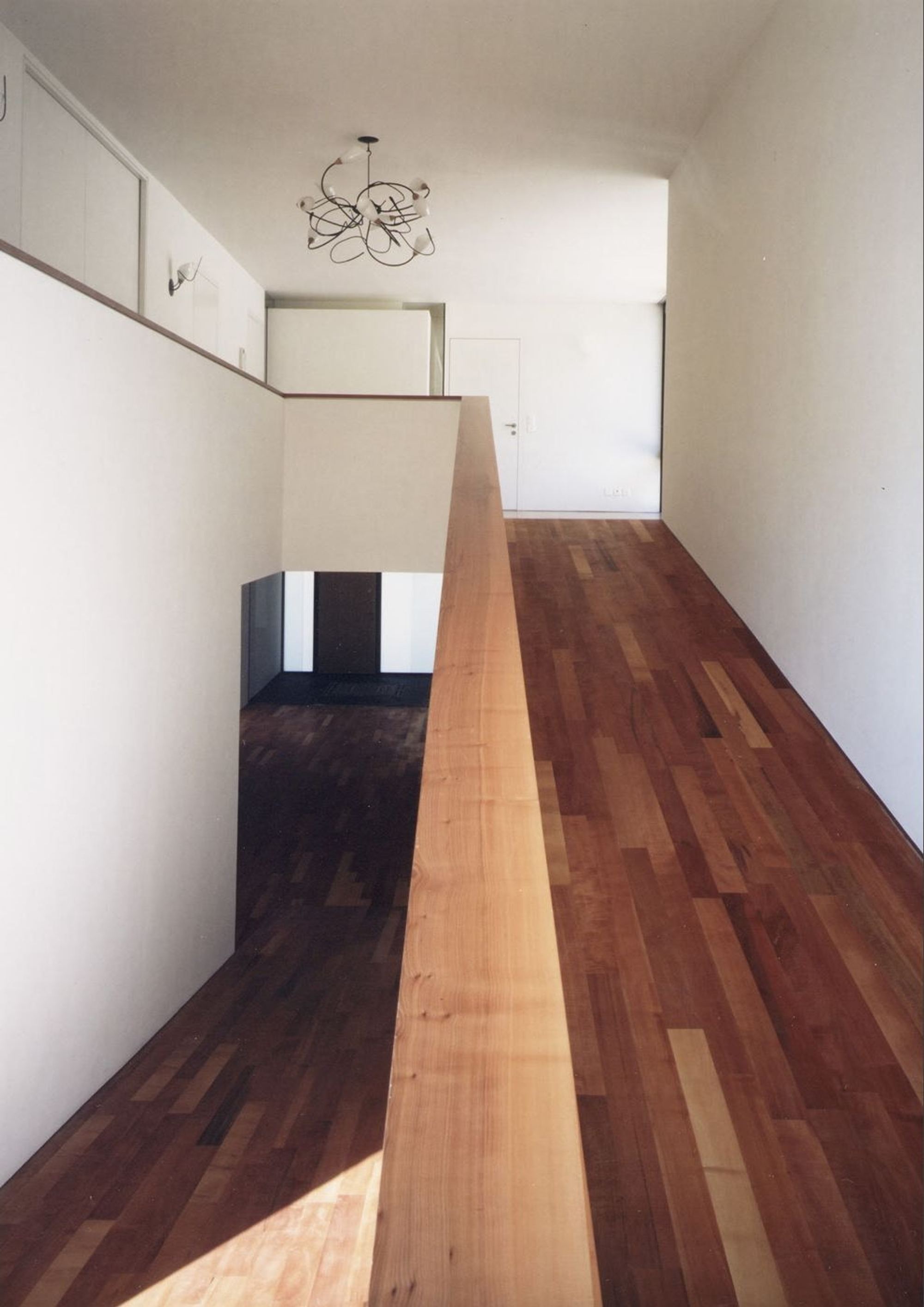 Gallery with timber floor and balustrade – Single-family house