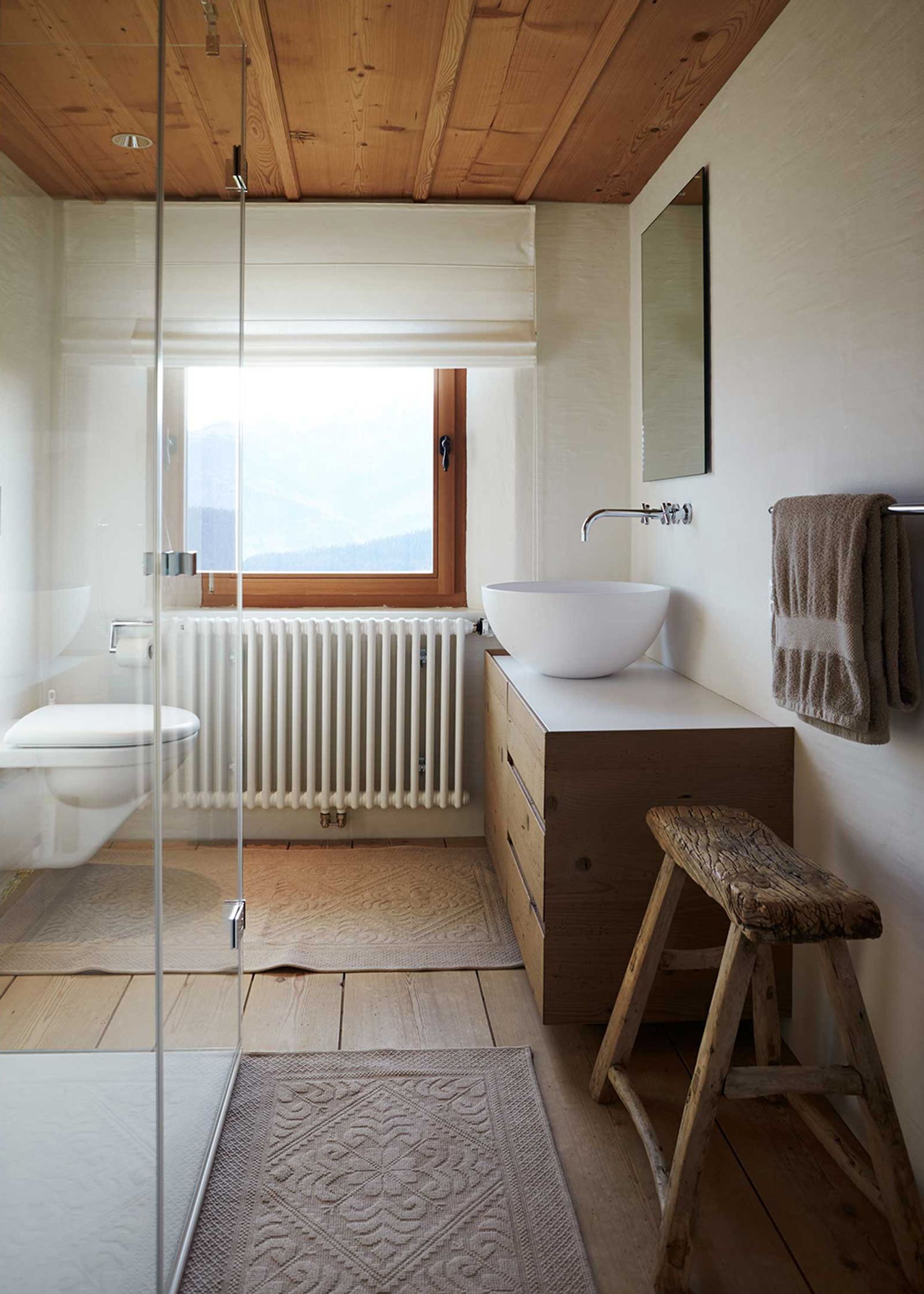 Bathroom with timber ceiling and wooden stool