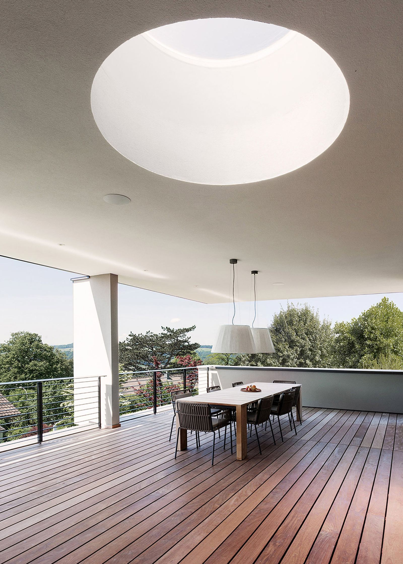 Covered terrace with circular skylight