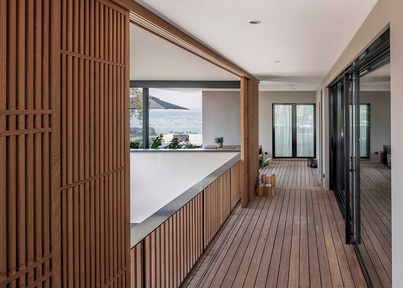 Timber louvres along the covered terrace