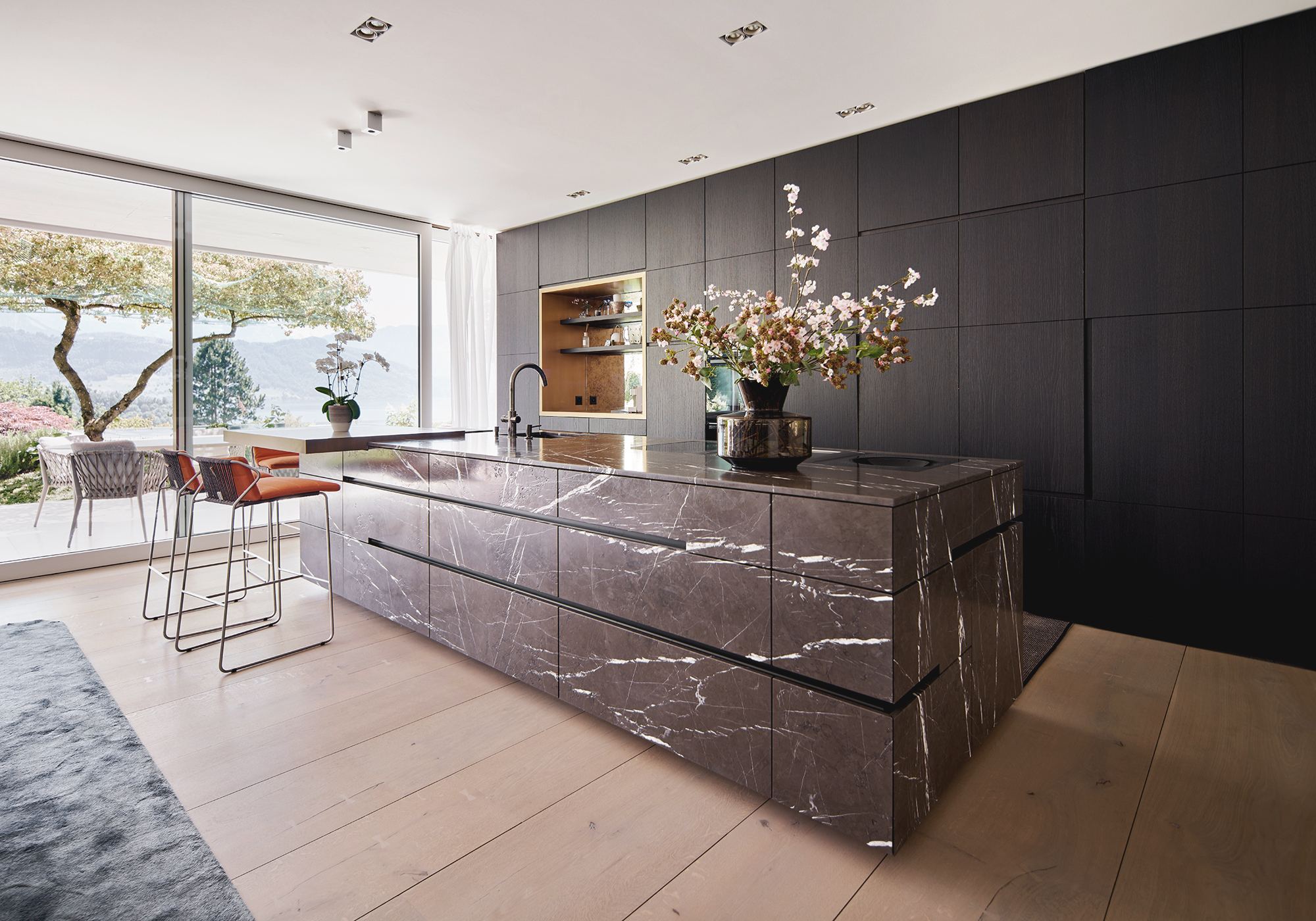 Kitchen with dark marble island and window front – Interiors and landscape, Luzern