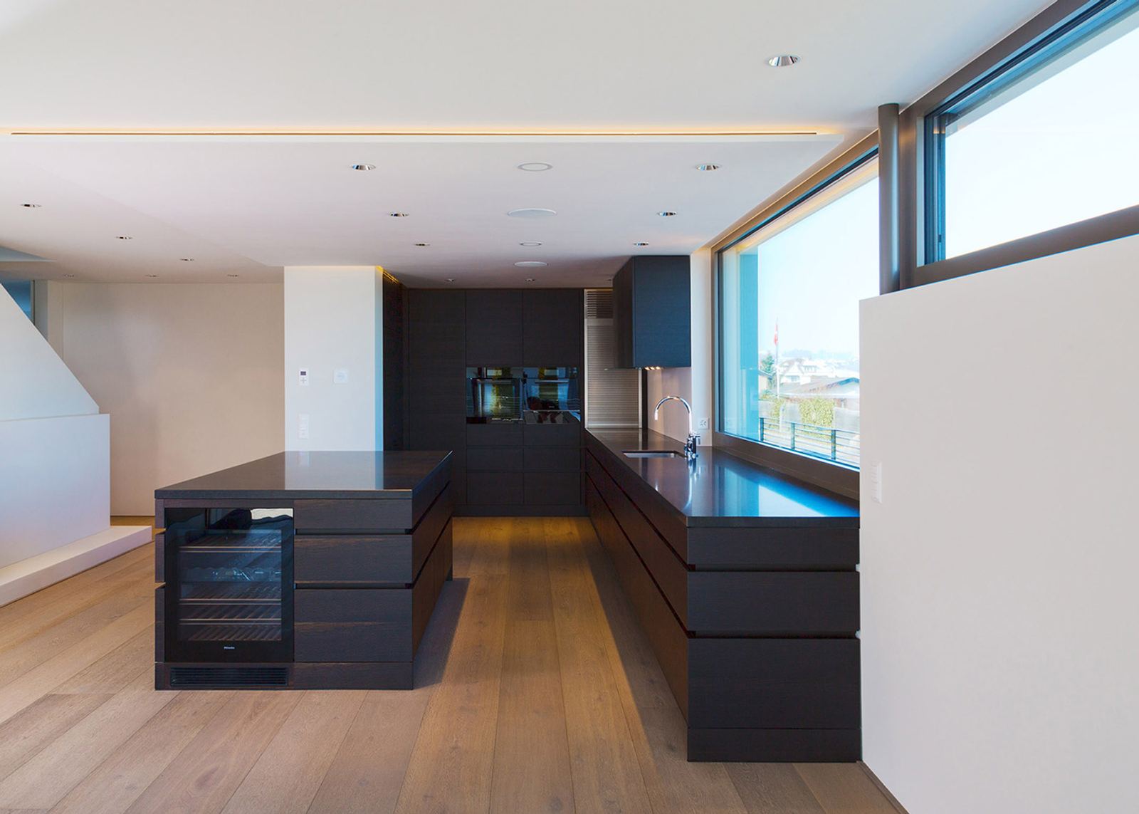 Dark kitchen run with ribbon window
