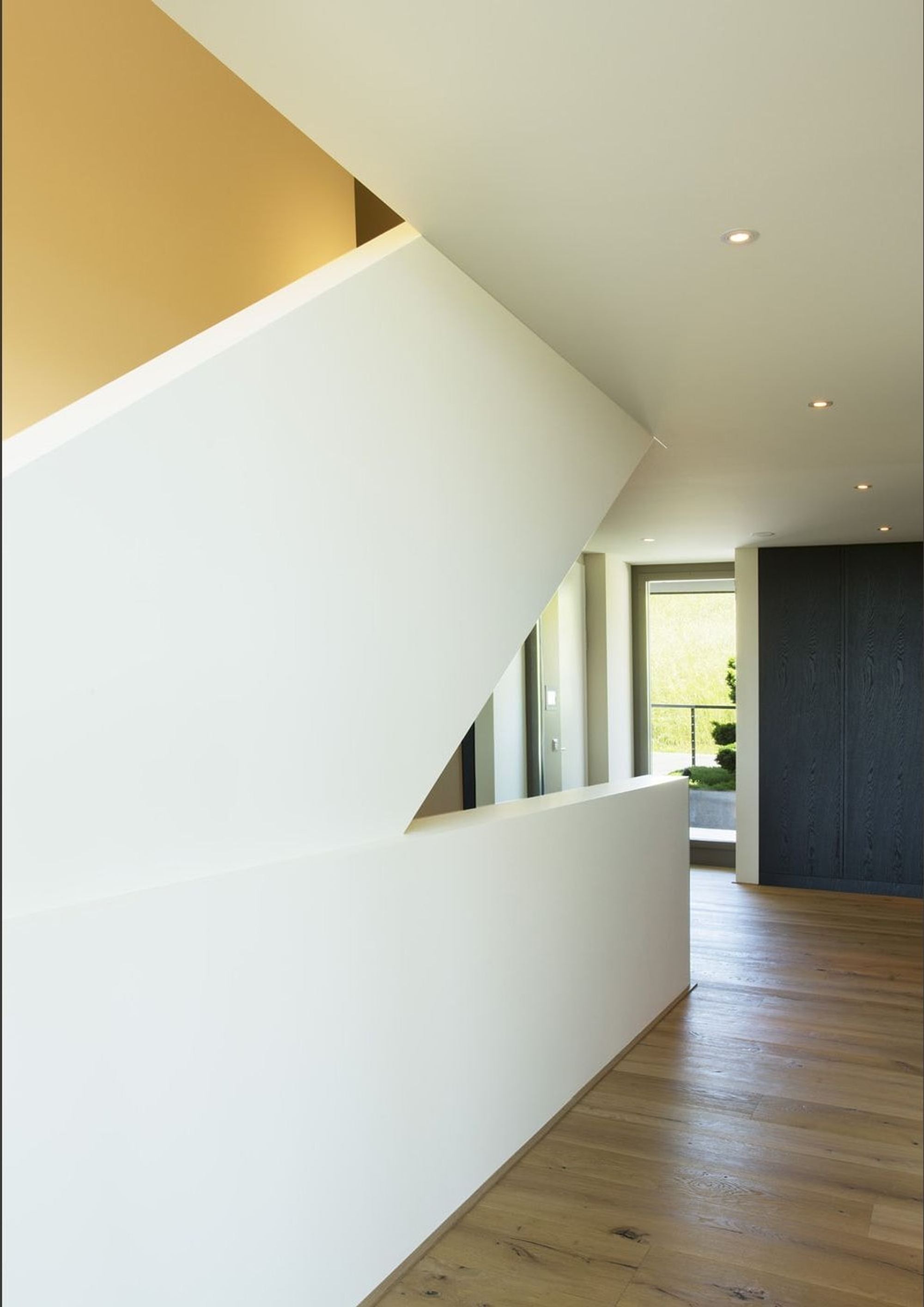 Staircase with white balustrade and skylight – Single-family house in Uitikon