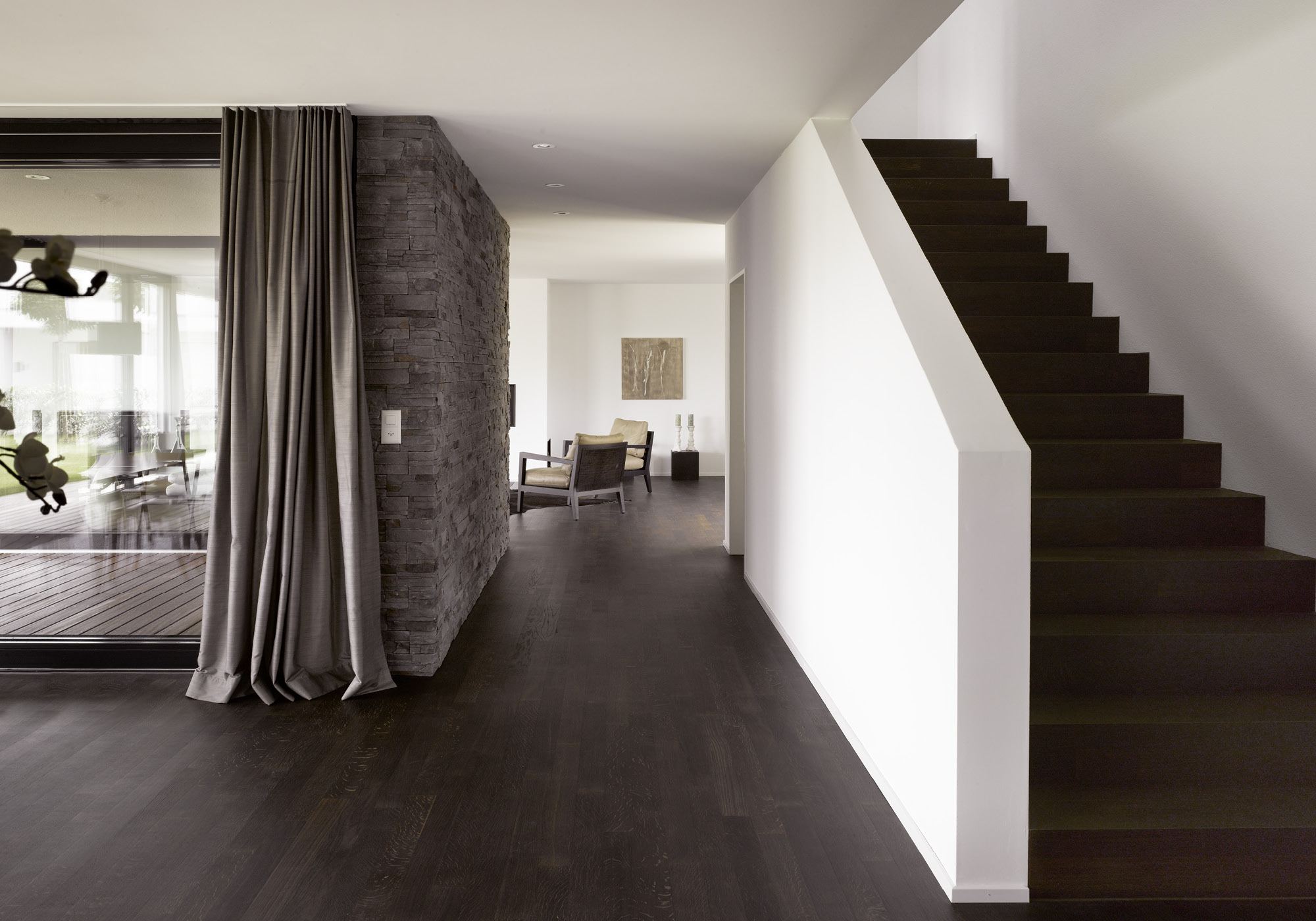 Staircase beside the natural stone wall – Single-family house in Möriken