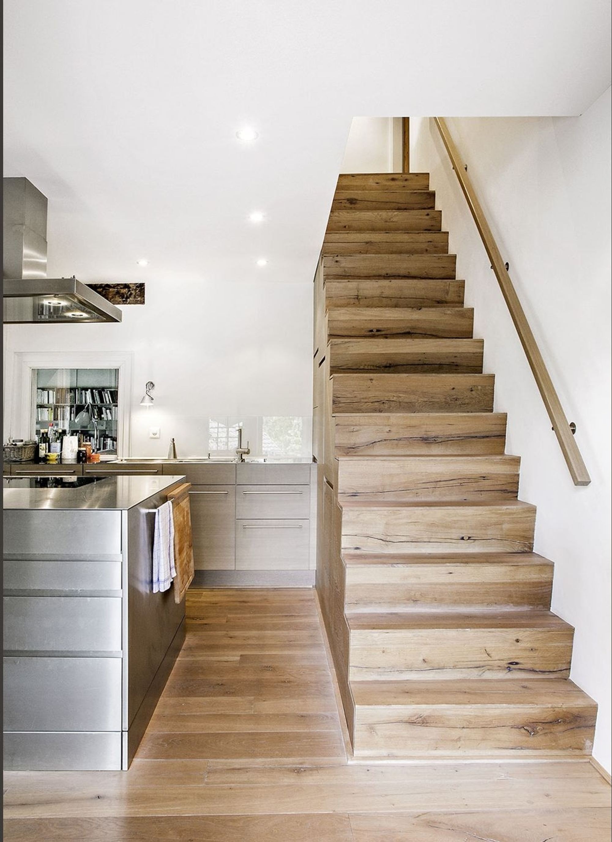 Timber staircase beside the kitchen – Historic conversion in Uerikon