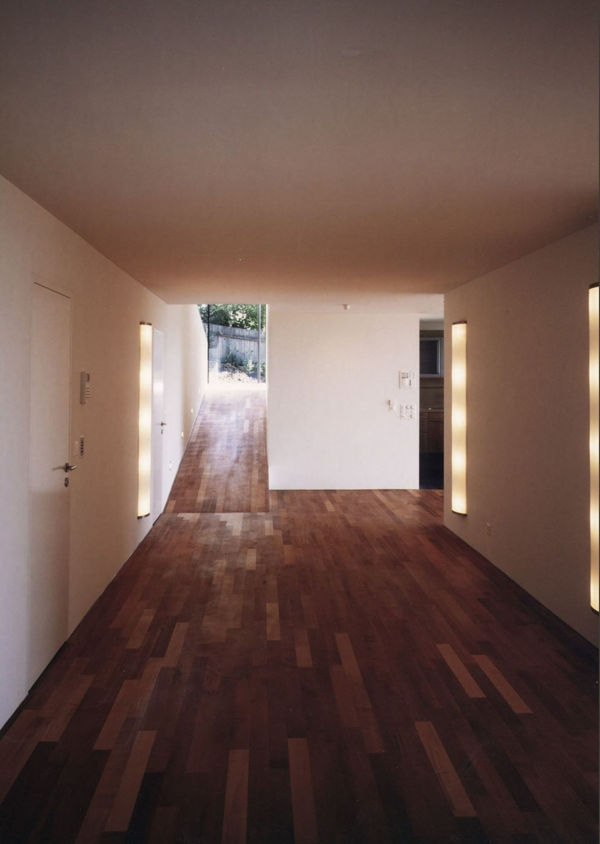 Hallway with timber floor and wall lights – Single-family house