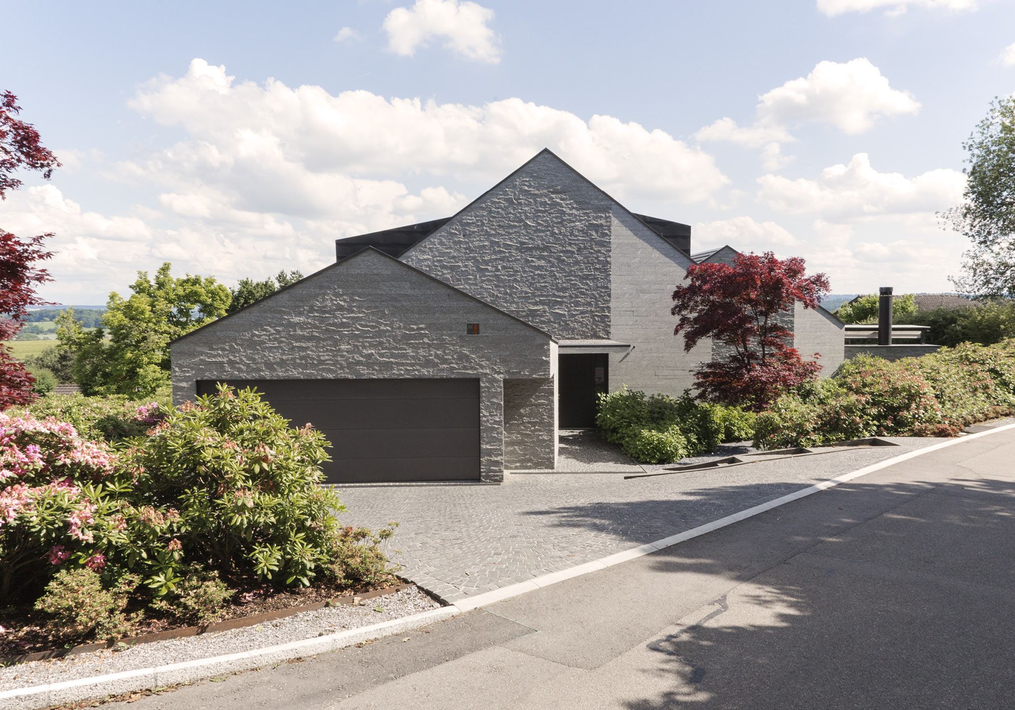 Street side with garage and gabled roof – Single-family house in Neerach