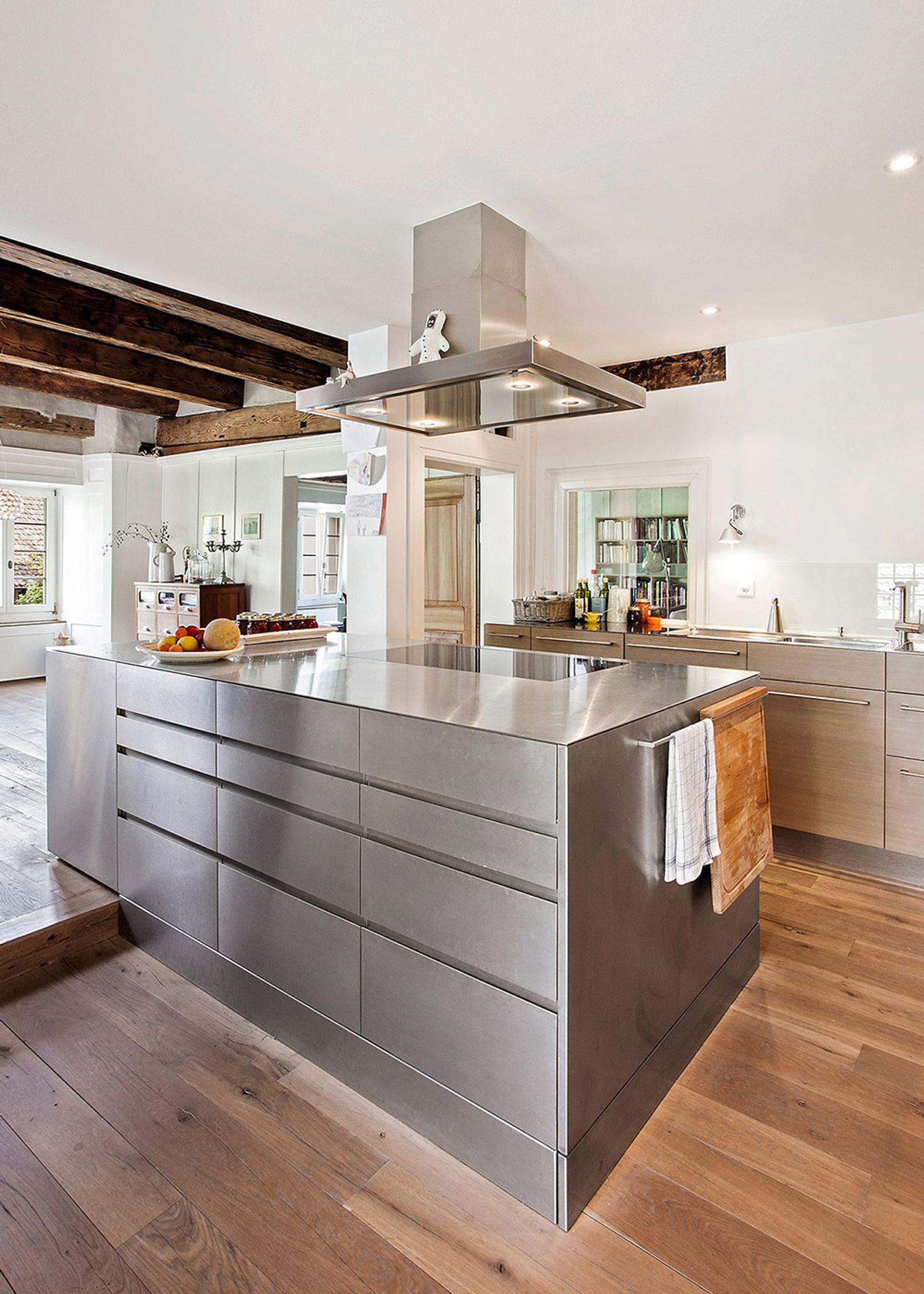 Stainless steel island with timber floor