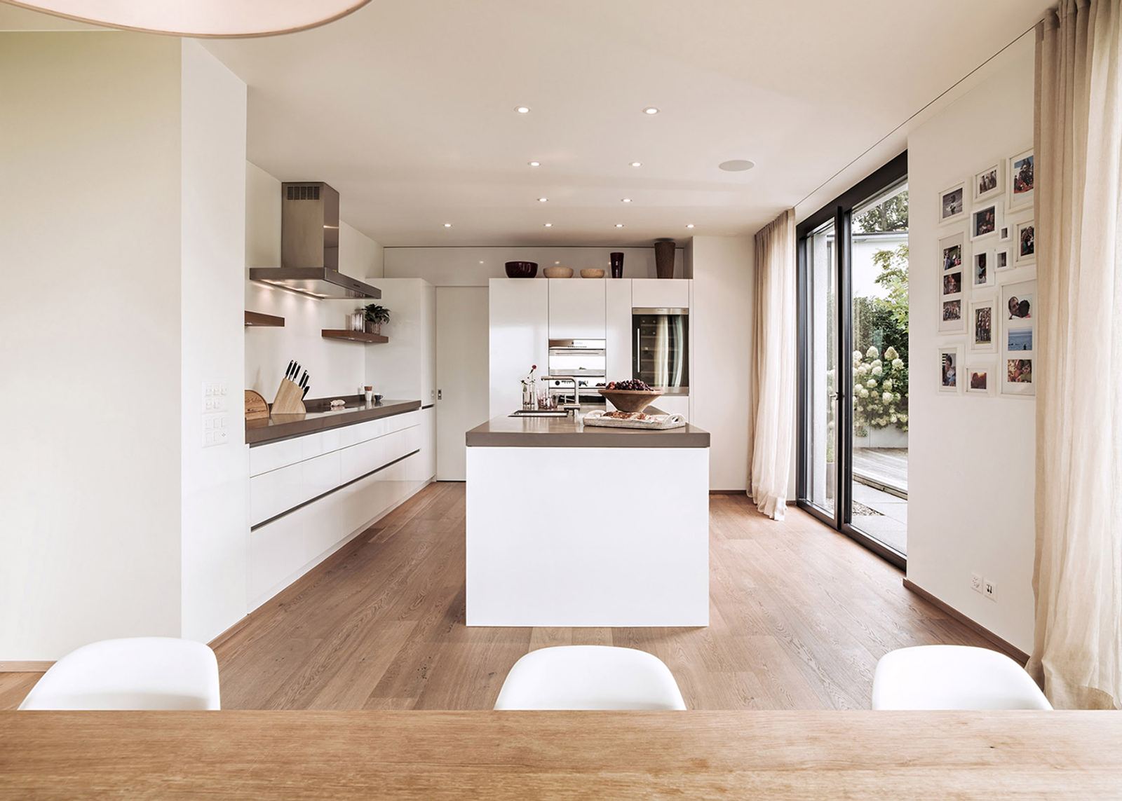 Open kitchen with island and photo wall