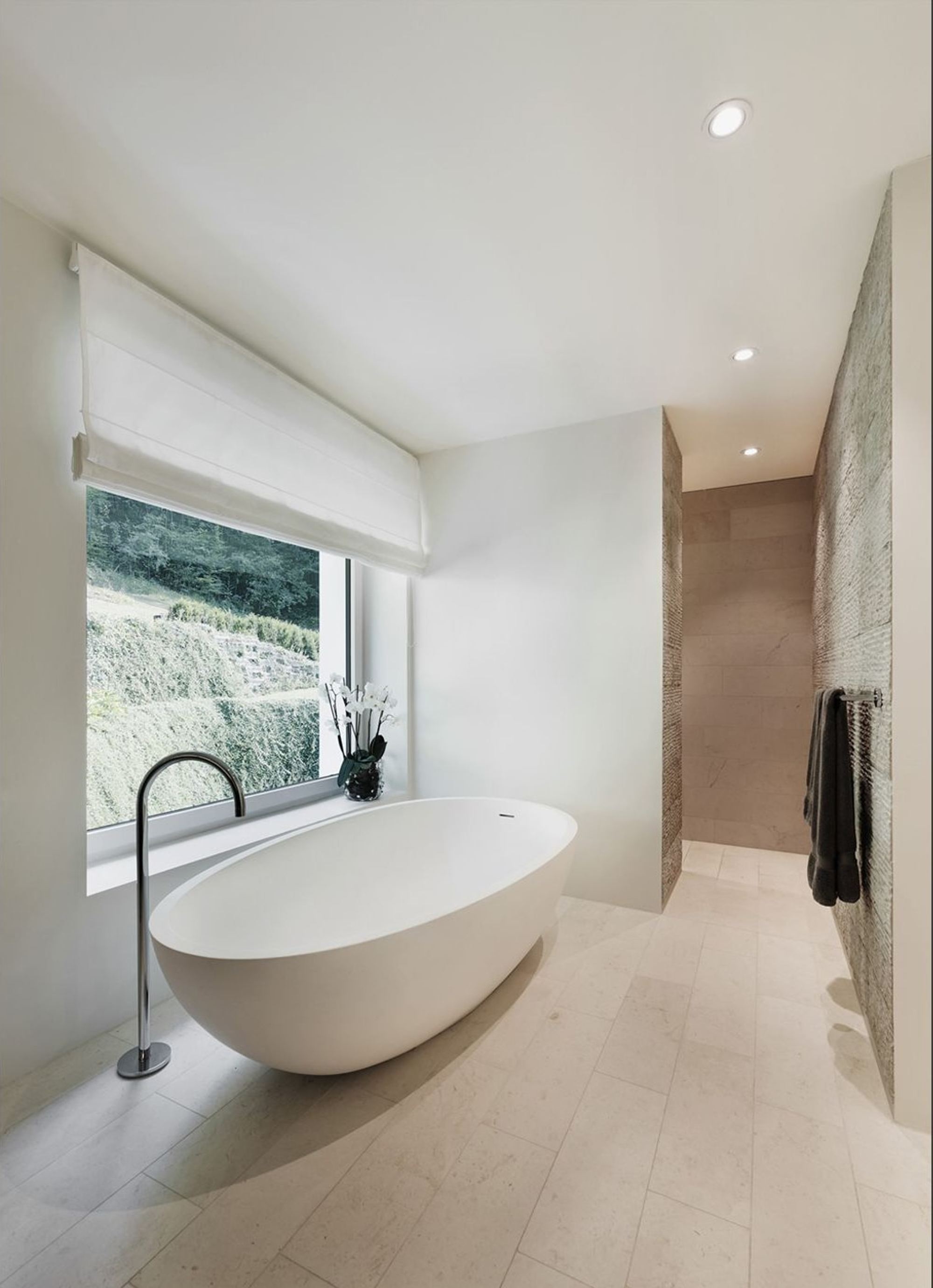 Freestanding bathtub by the window – Interiors and landscape, Stallikon