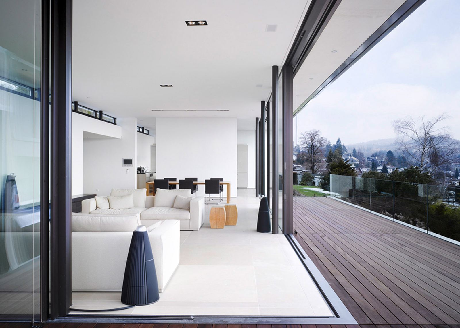 Living space with white sofa and timber terrace