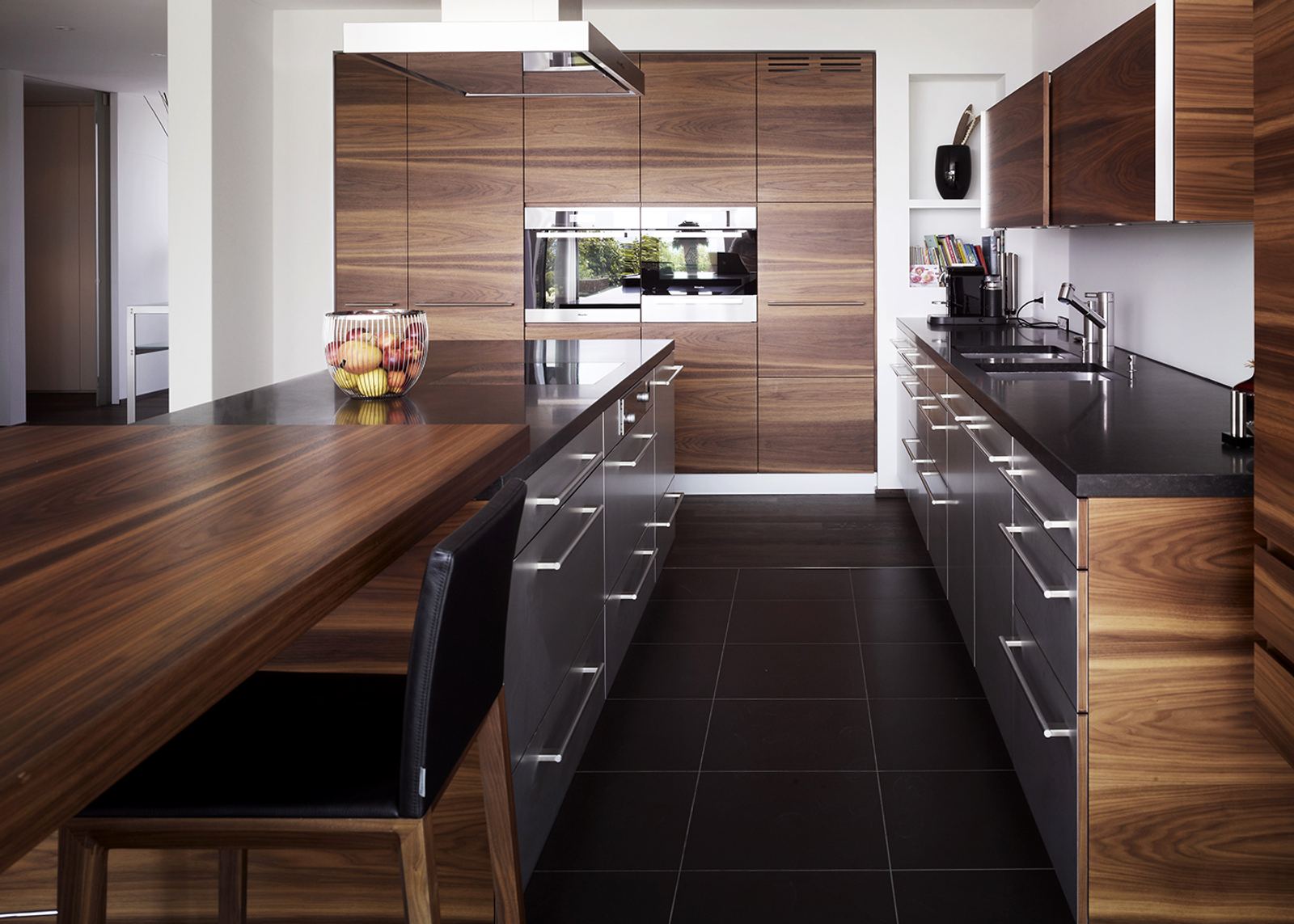 Island with timber counter and dark floor