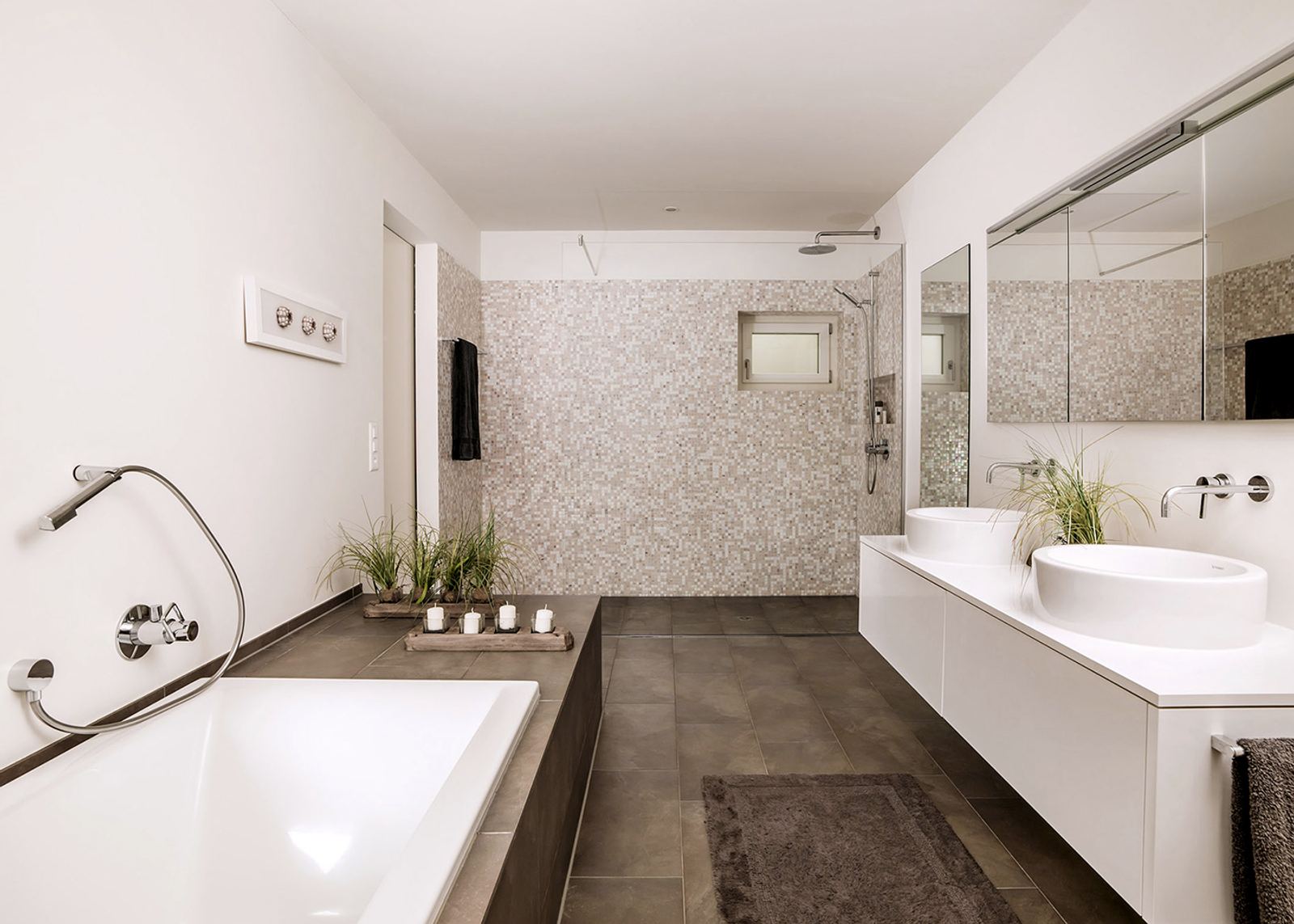 Bathroom with built-in bath and mosaic wall