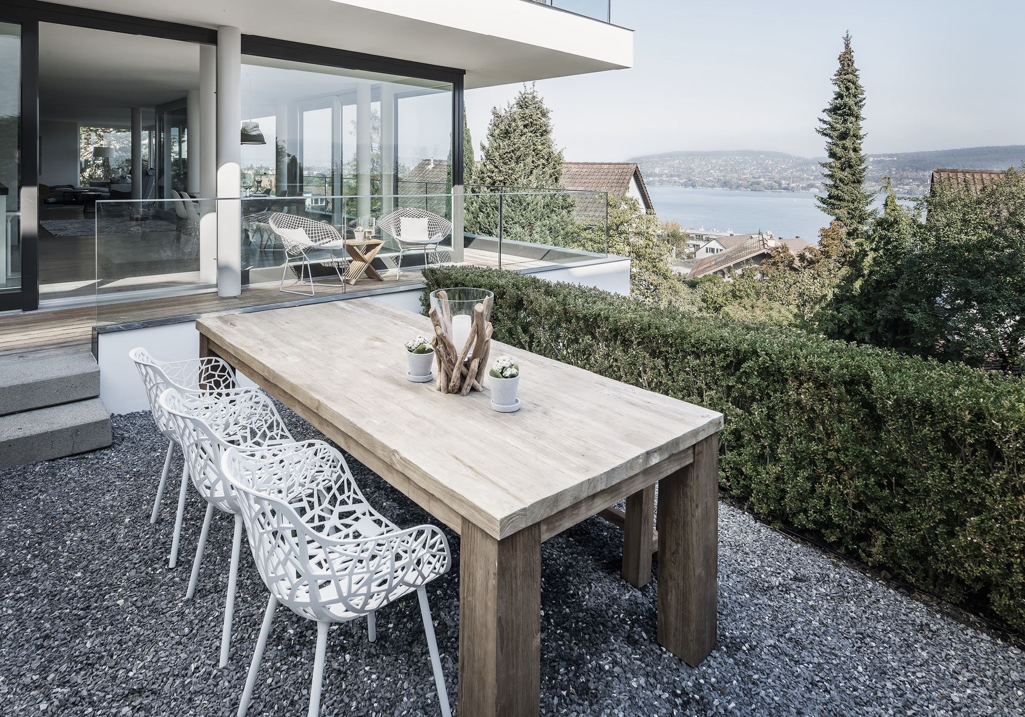 Outdoor dining table with view of Lake Zurich – Interiors and landscape, Kilchberg
