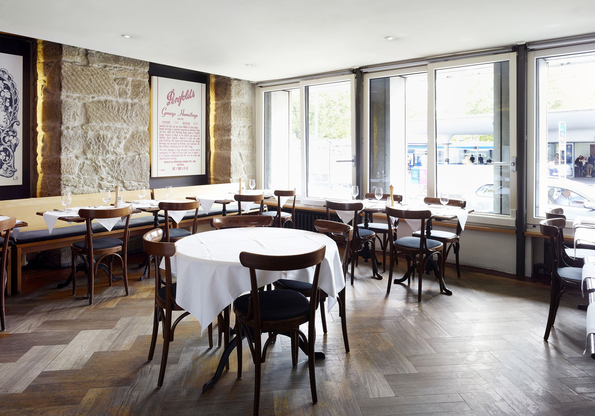 Laid tables by the window with parquet floor – Interiors and landscape, Zürich