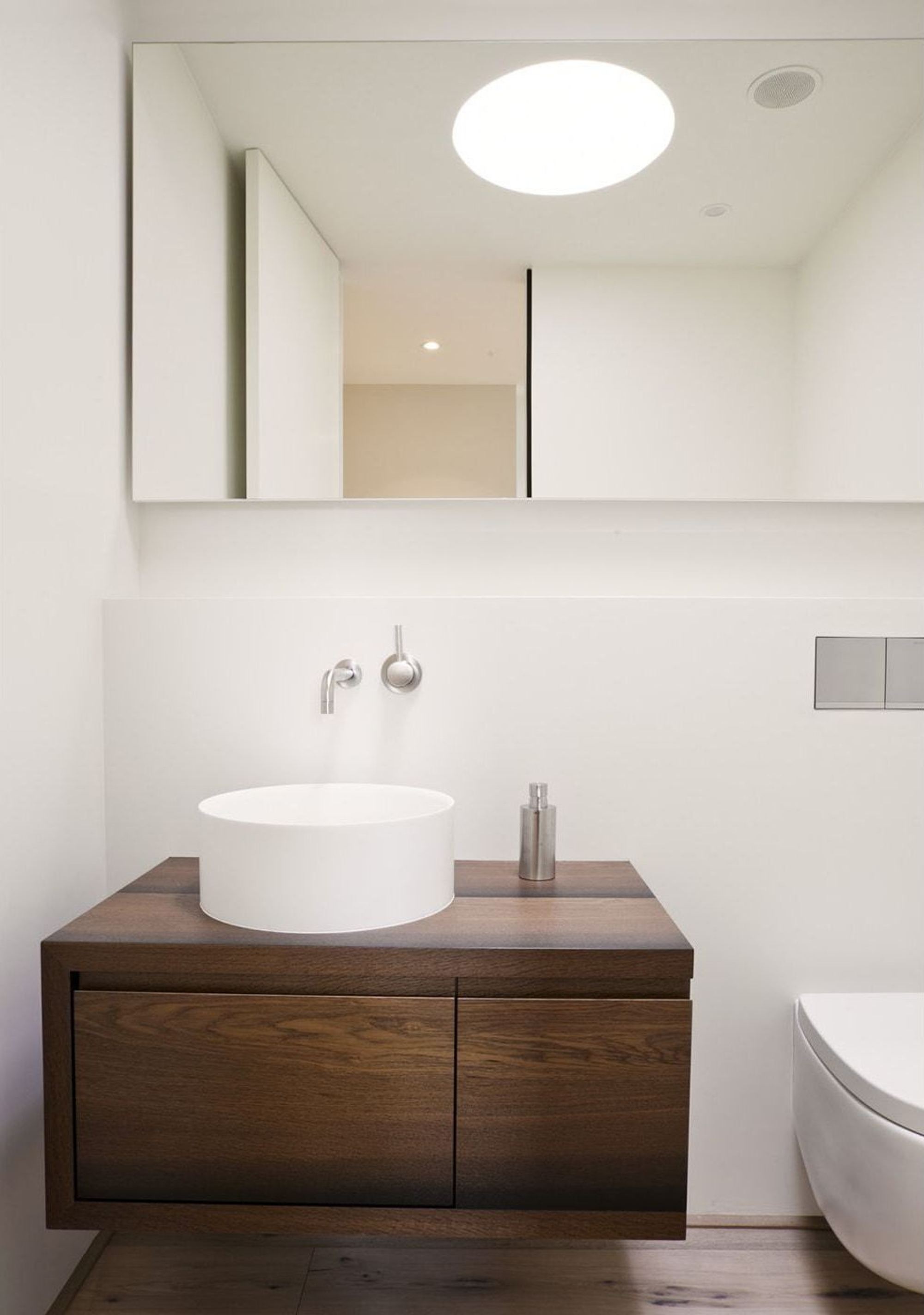 Guest WC with timber vanity and skylight – Single-family house in Oberwil-Lieli