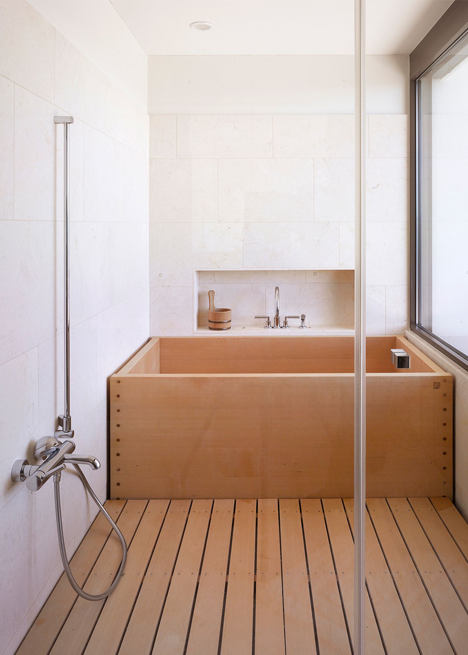 Japanese-style bathroom with wooden tub