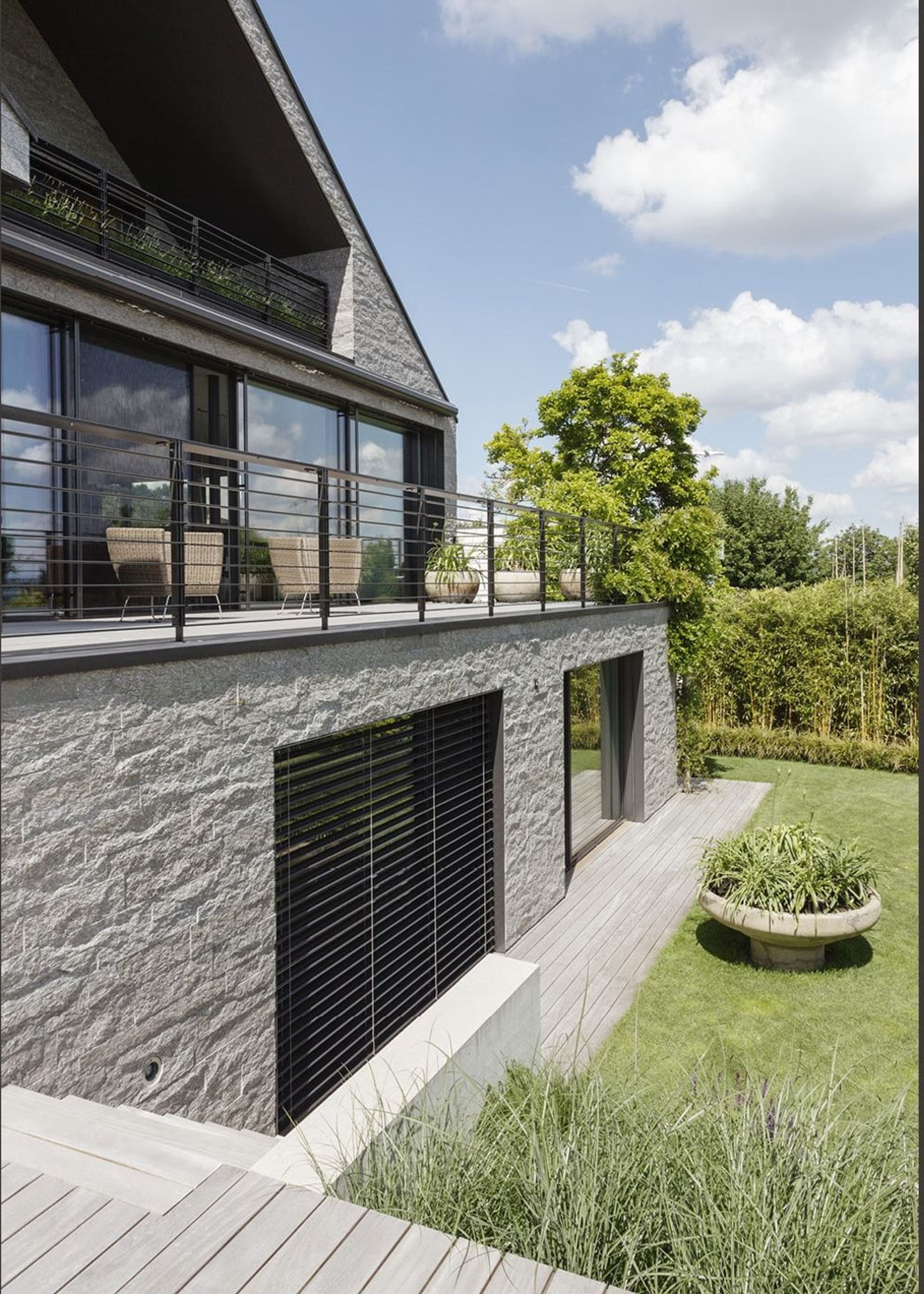 Garden side with stone base and balcony – Single-family house in Neerach