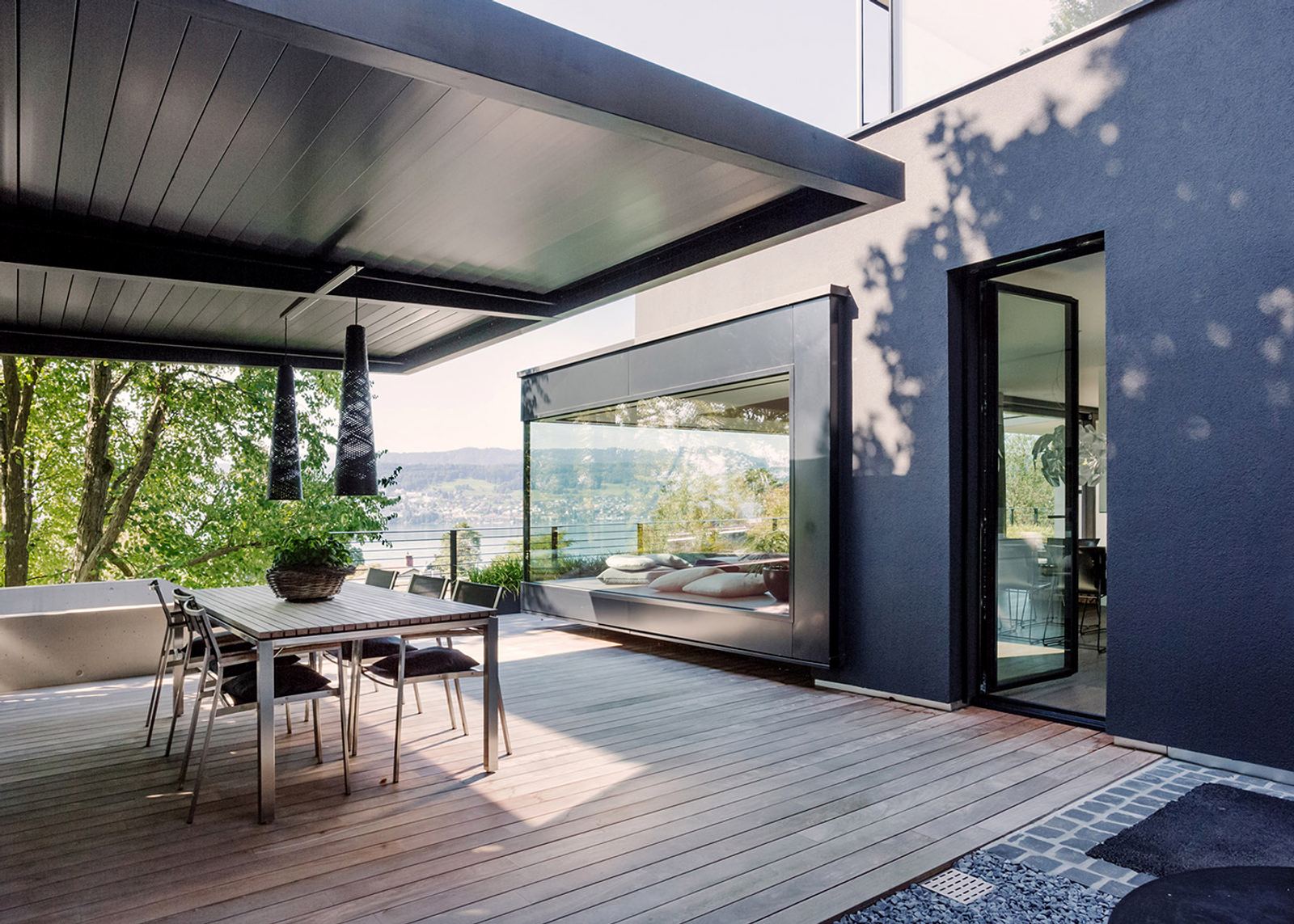 Timber terrace with dining table under the canopy