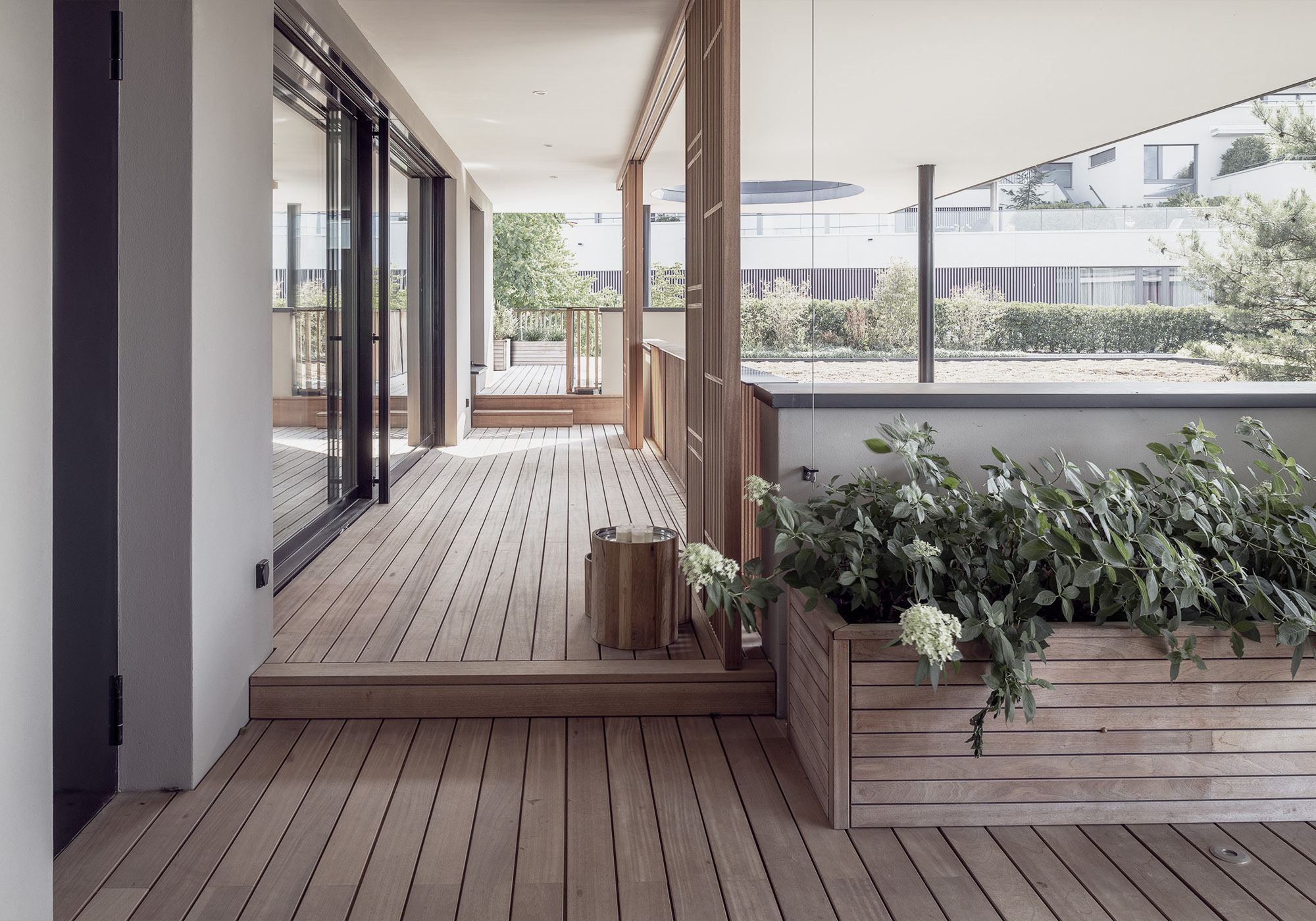 Veranda with timber deck and planter – Single-family house in Schindellegi