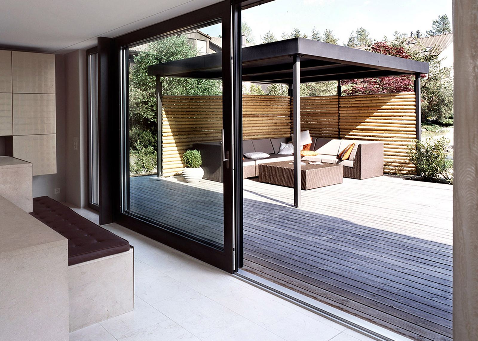 Sliding glass door to the timber terrace with pavilion
