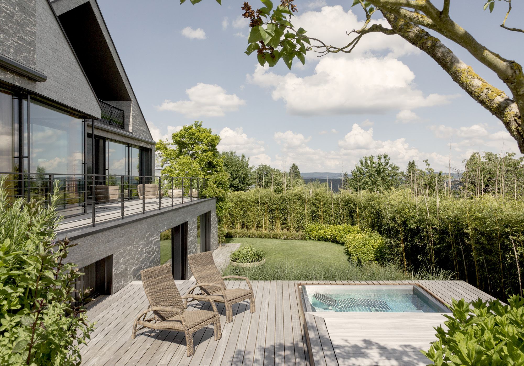 Timber deck with loungers and green view – Single-family house in Neerach