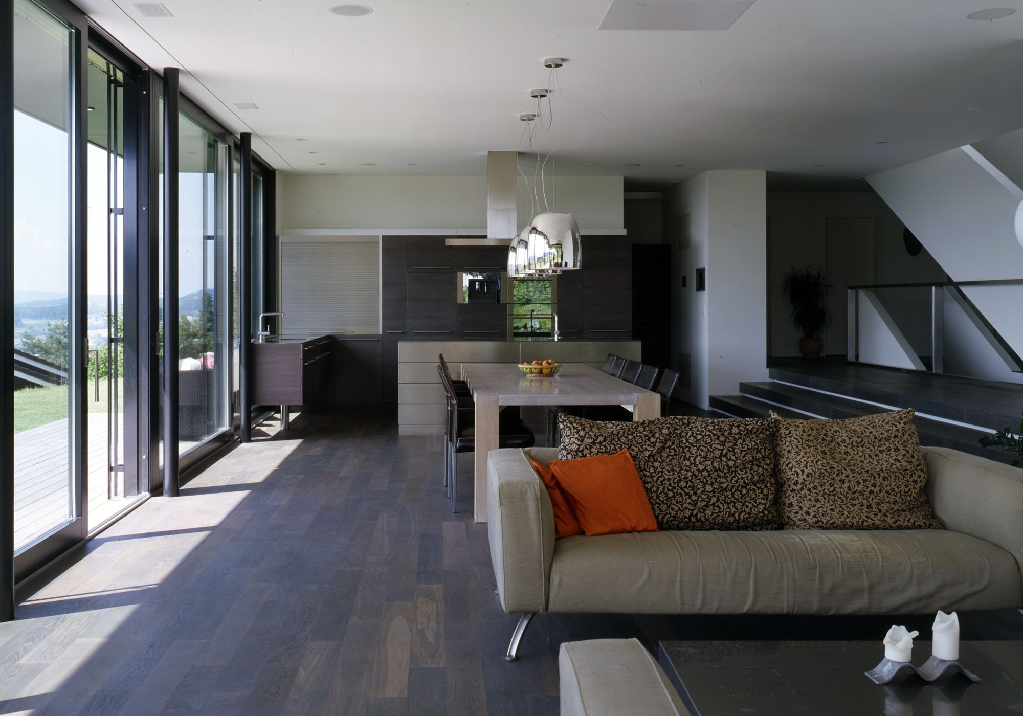 Living space with sofa and glass front – Single-family house in Bonstetten