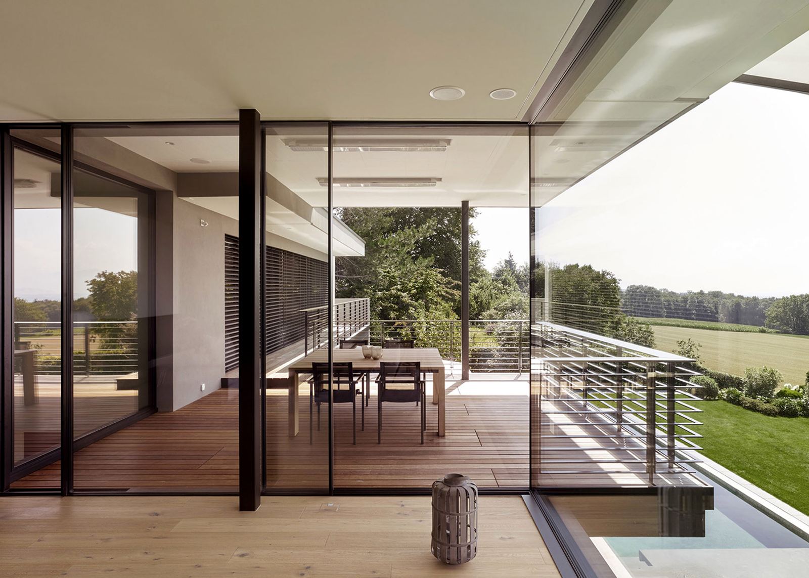 Glazed terrace with dining table
