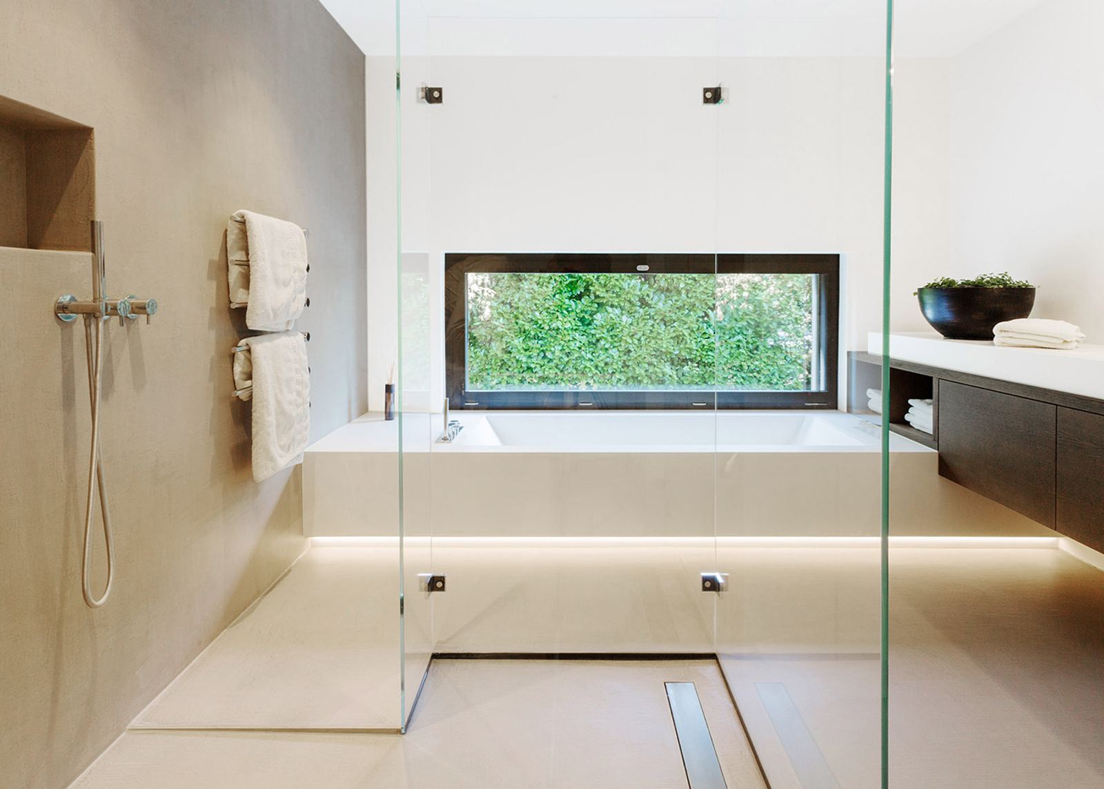 Bathroom with glass shower and built-in bath