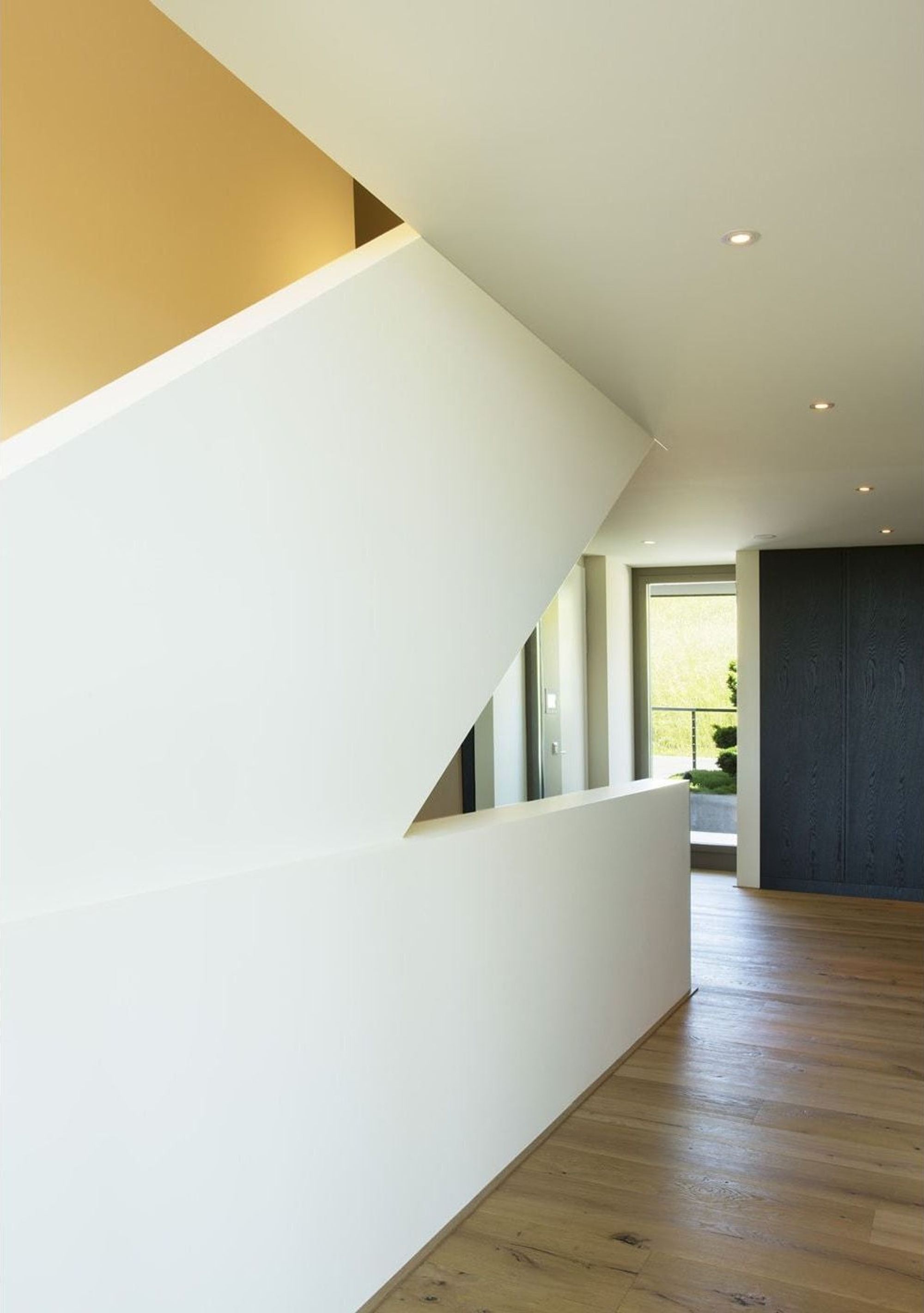 Staircase with white balustrade and skylight – Single-family house in Uitikon
