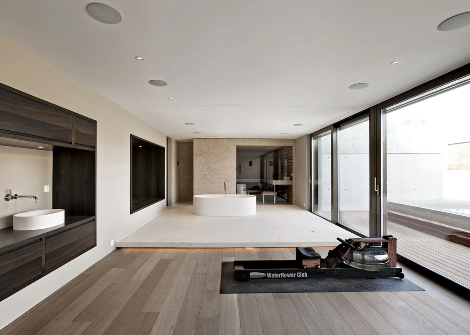 Open bathroom with bath and timber floor