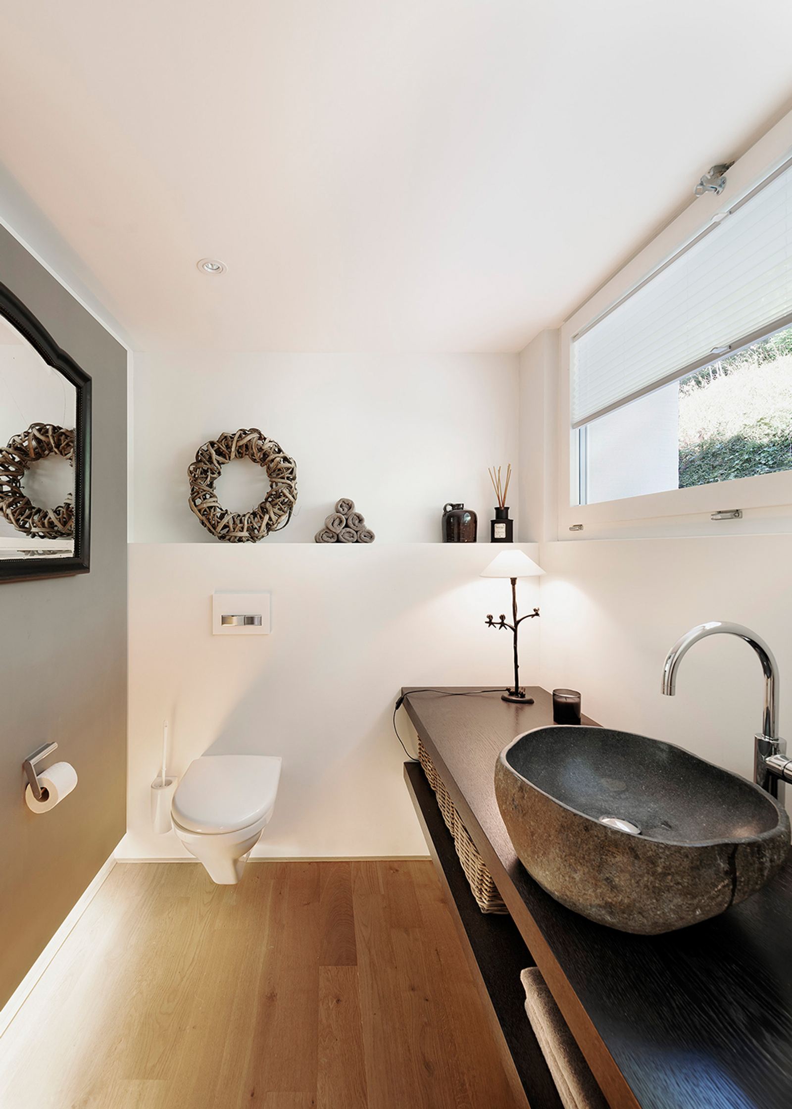 Stone basin on a timber shelf