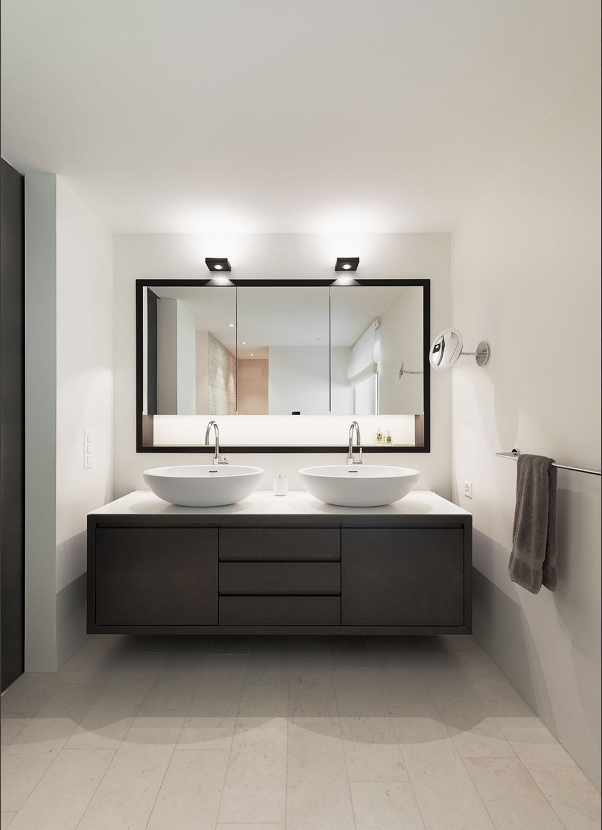 Bathroom with double vanity and illuminated mirror – Interiors and landscape, Stallikon