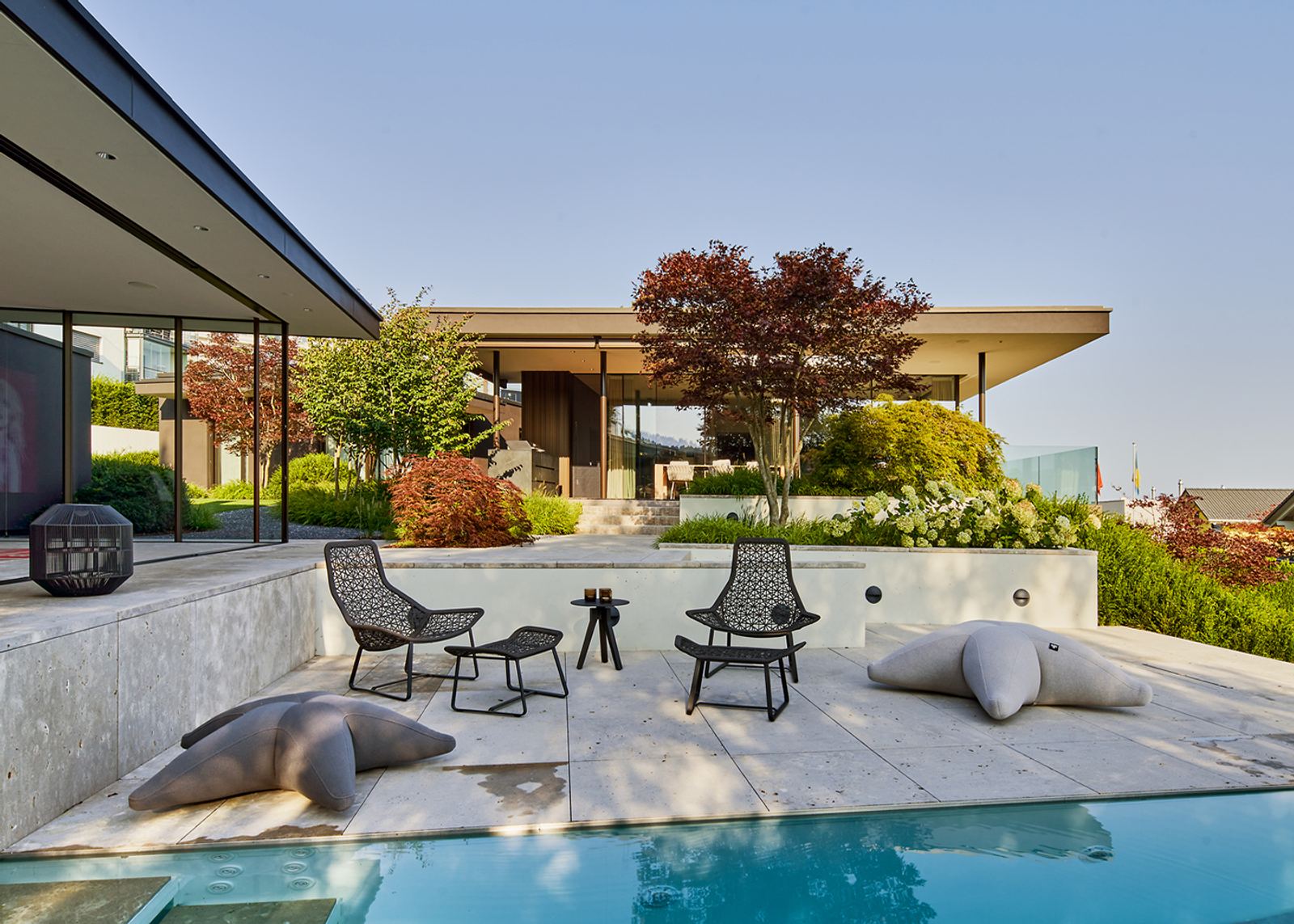 Pool terrace with beanbags and chairs