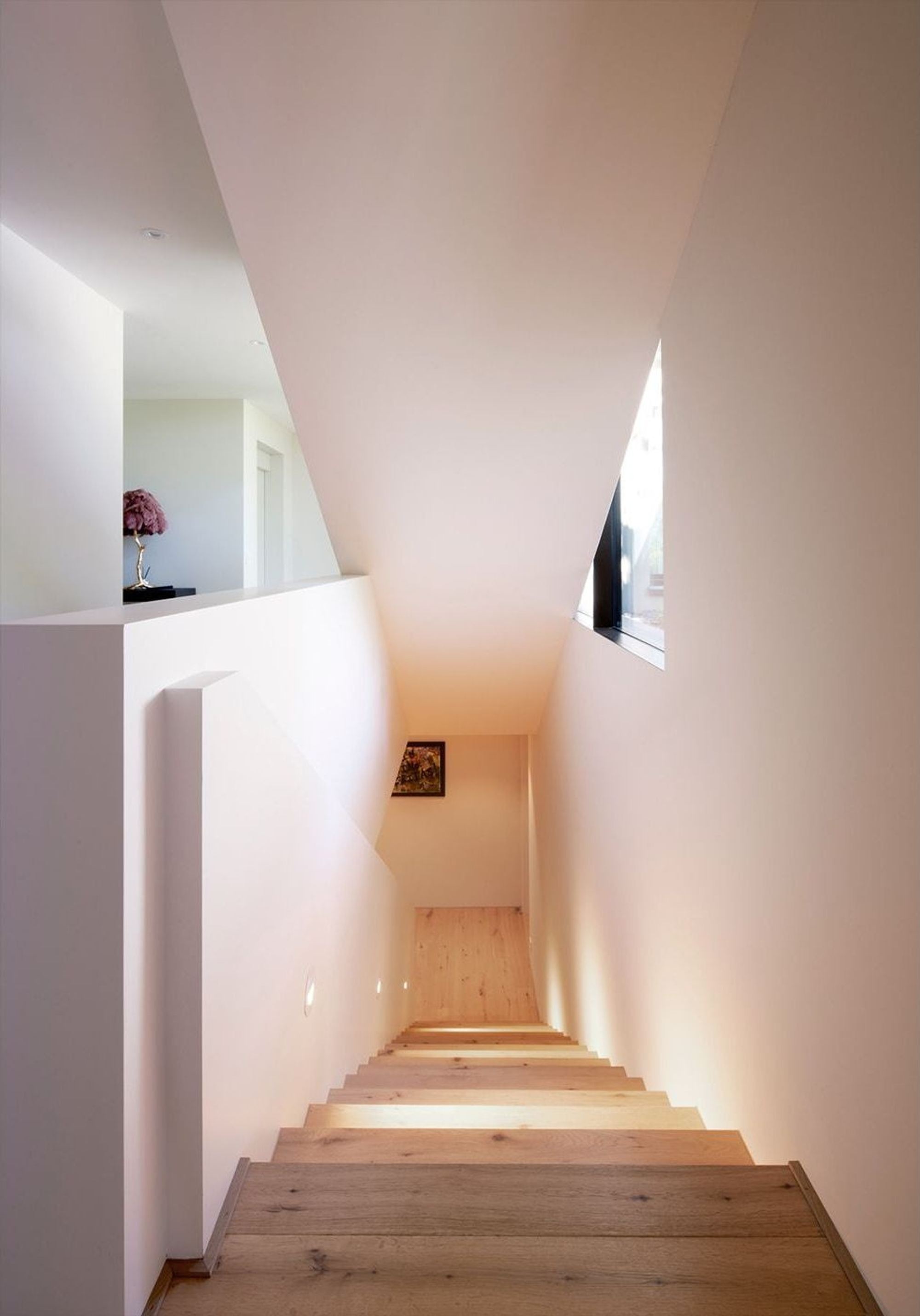 Stairway down with timber steps and skylight – Single-family house in Herrliberg