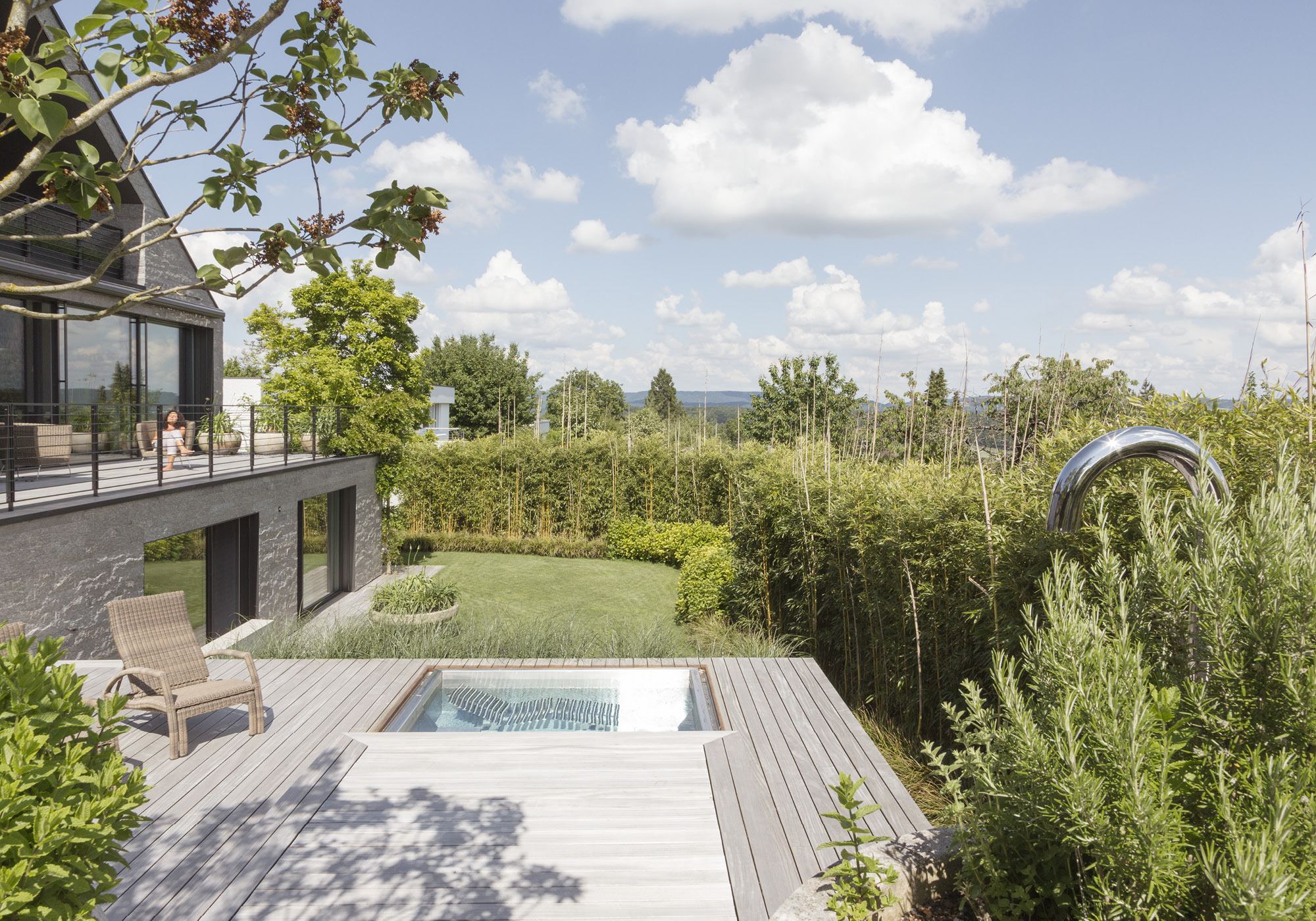 Timber deck with small pool and sculpture in the garden – Single-family house in Neerach