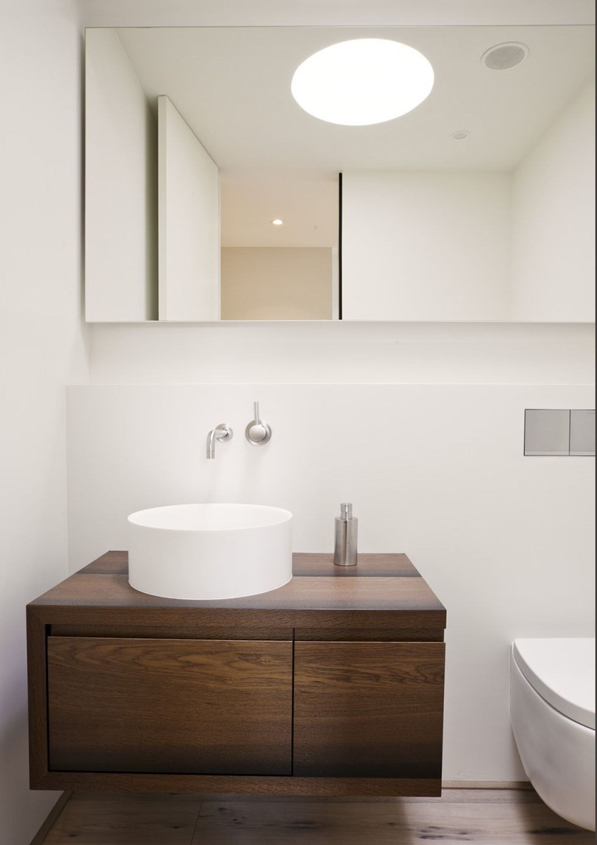 Guest WC with timber vanity and skylight – Single-family house in Oberwil-Lieli