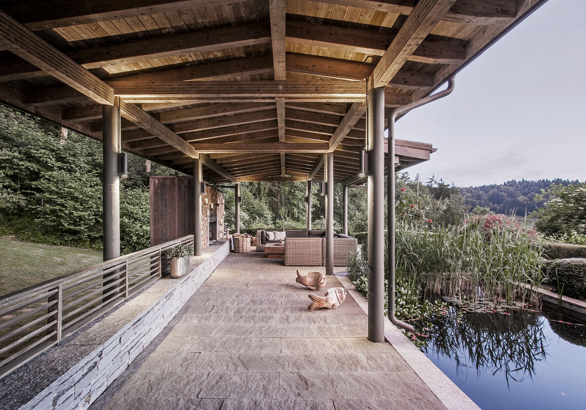 Timber-roofed veranda along the pond – Interiors and landscape, Stallikon