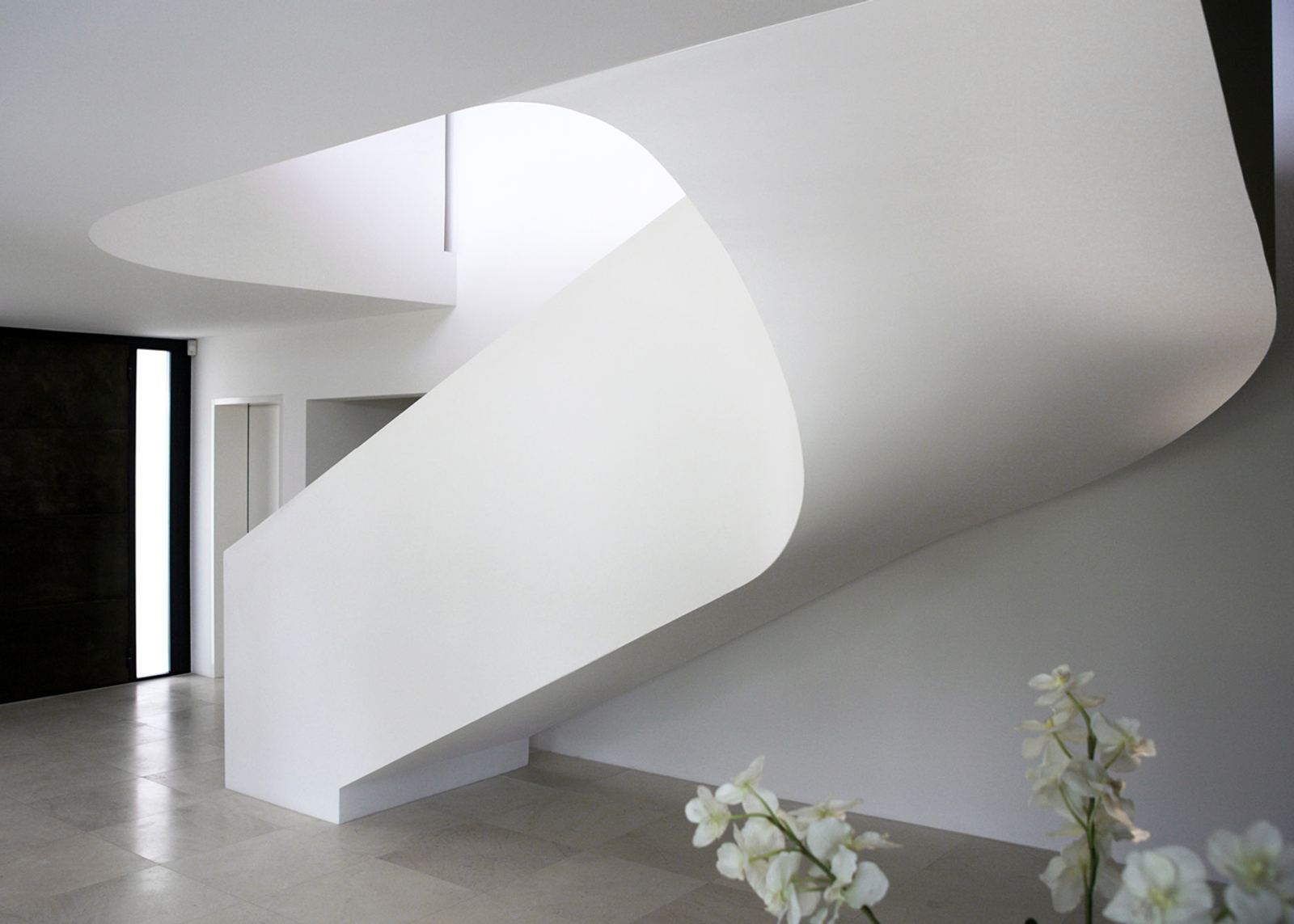 Sculptural white spiral staircase