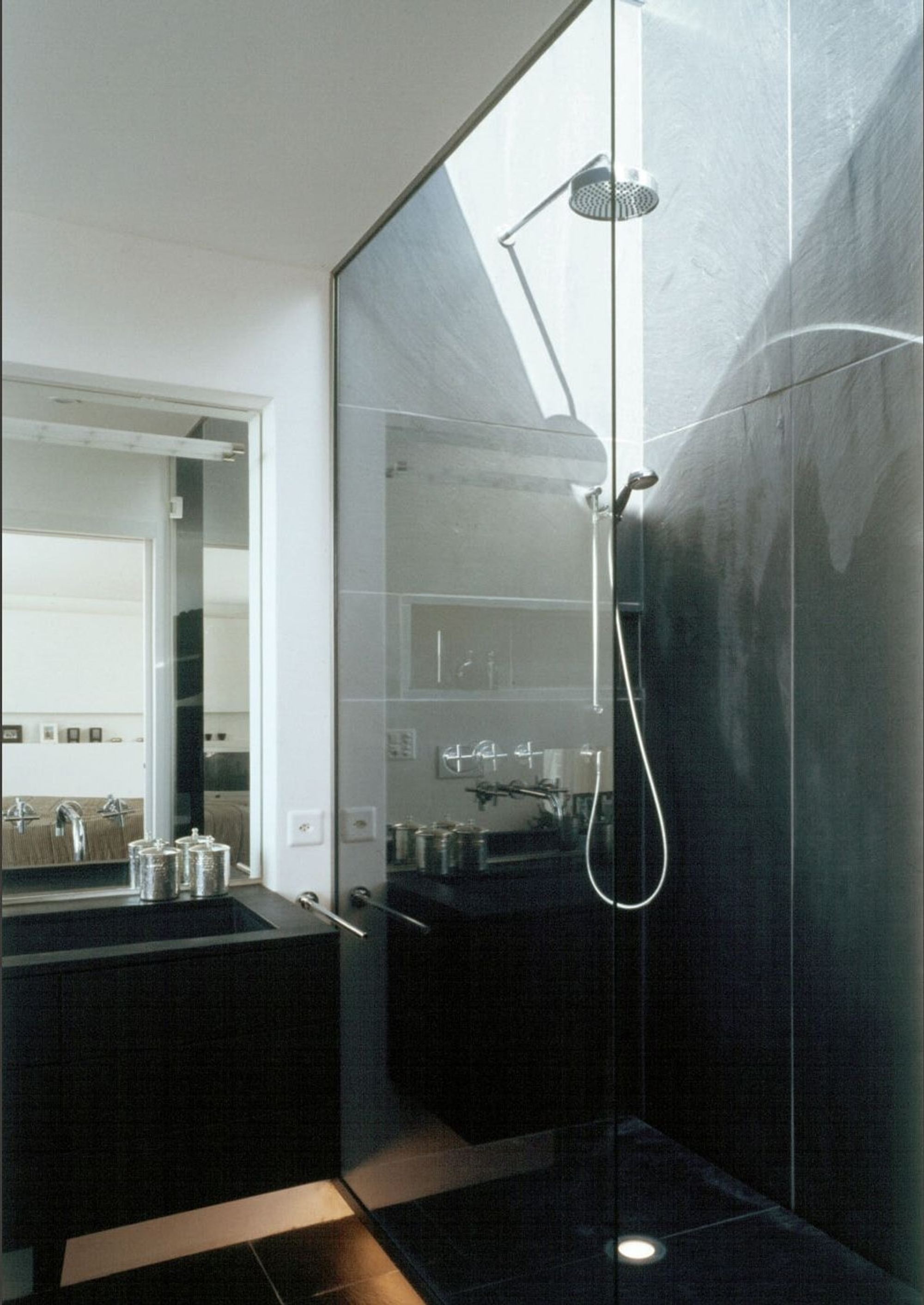 Shower with dark tiles and glass wall – Single-family house in Davos Platz