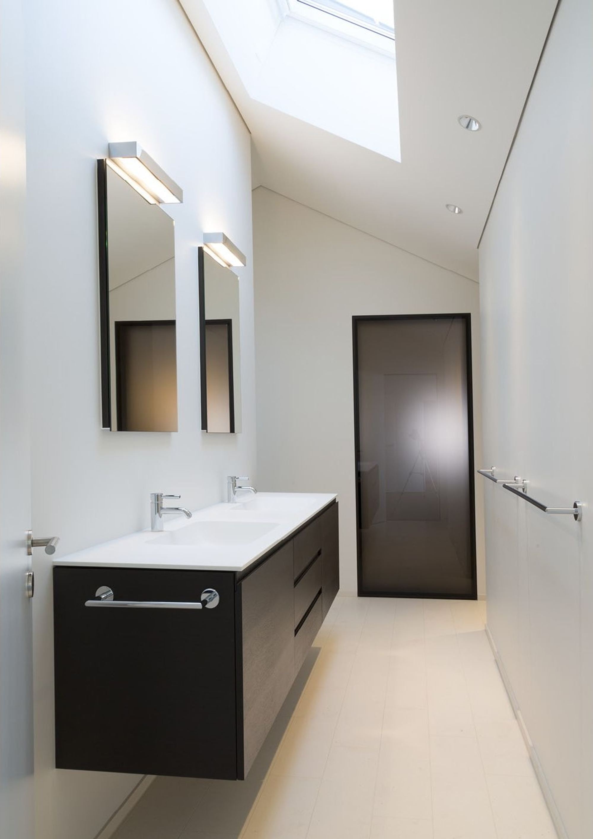 Bathroom with washbasin under the sloping roof – Single-family house in Wollerau