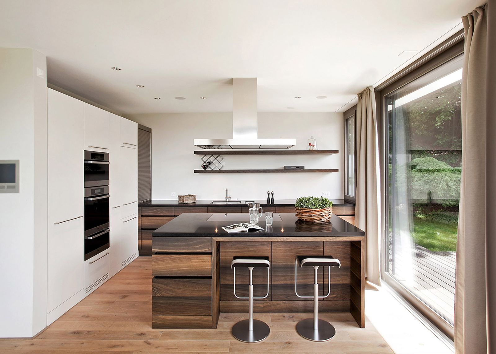 Kitchen with timber island and bar stools
