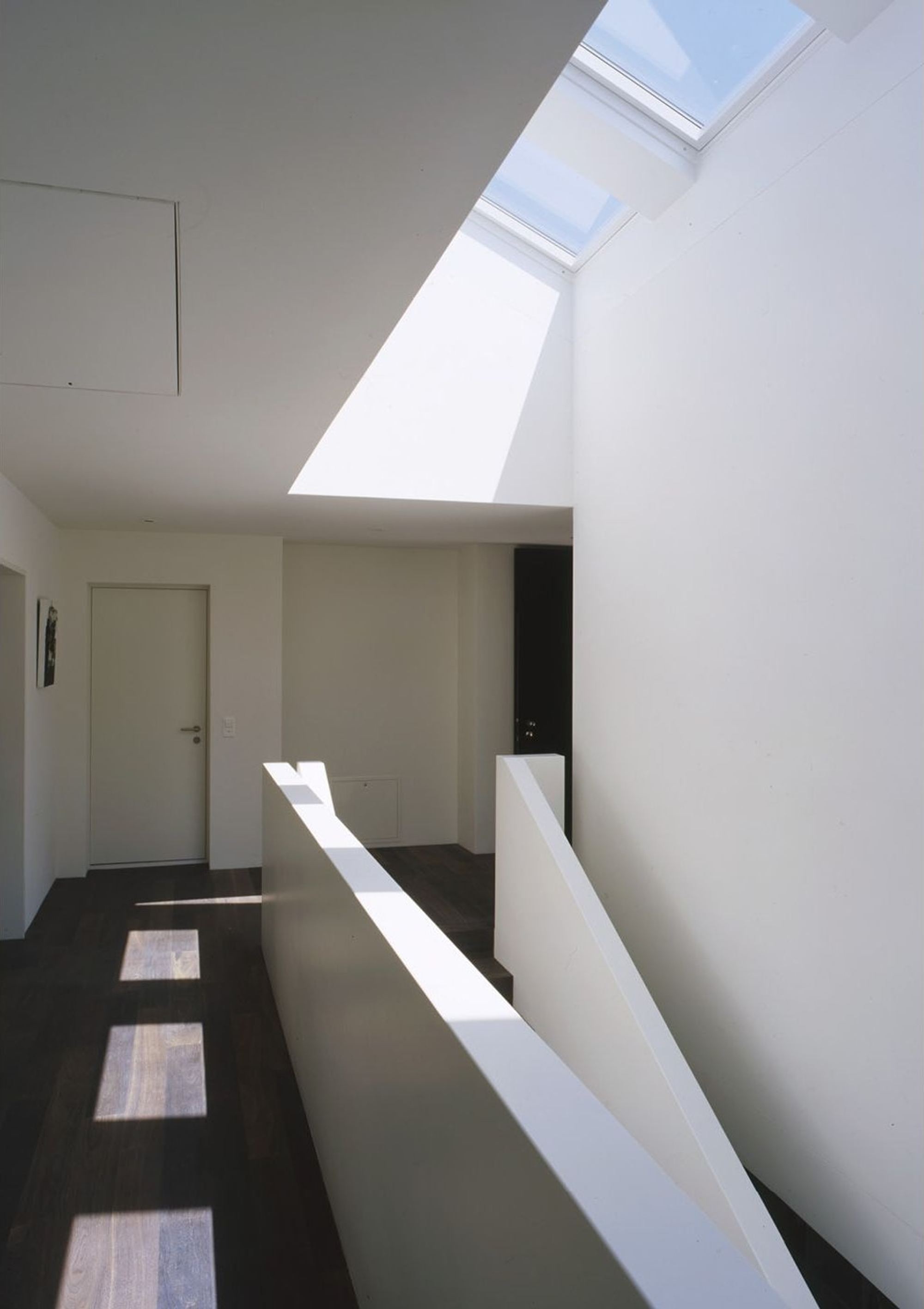 Gallery with roof window and white balustrade – Single-family house in Bonstetten