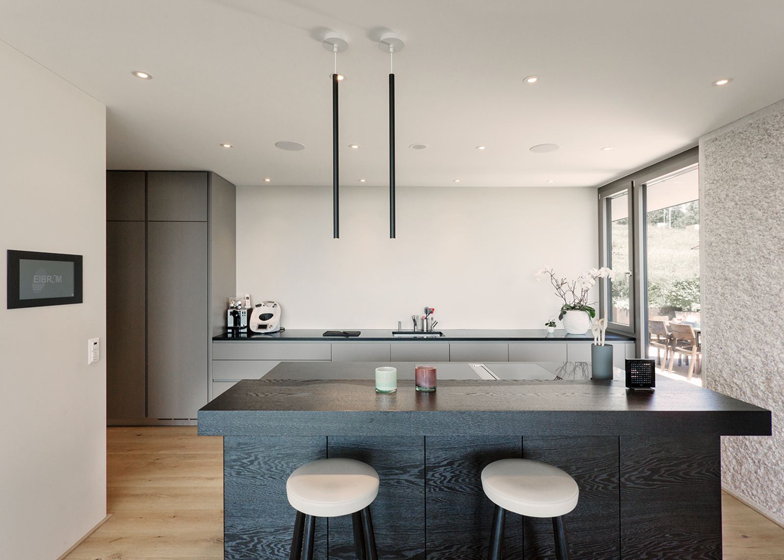 Dark island with white stools